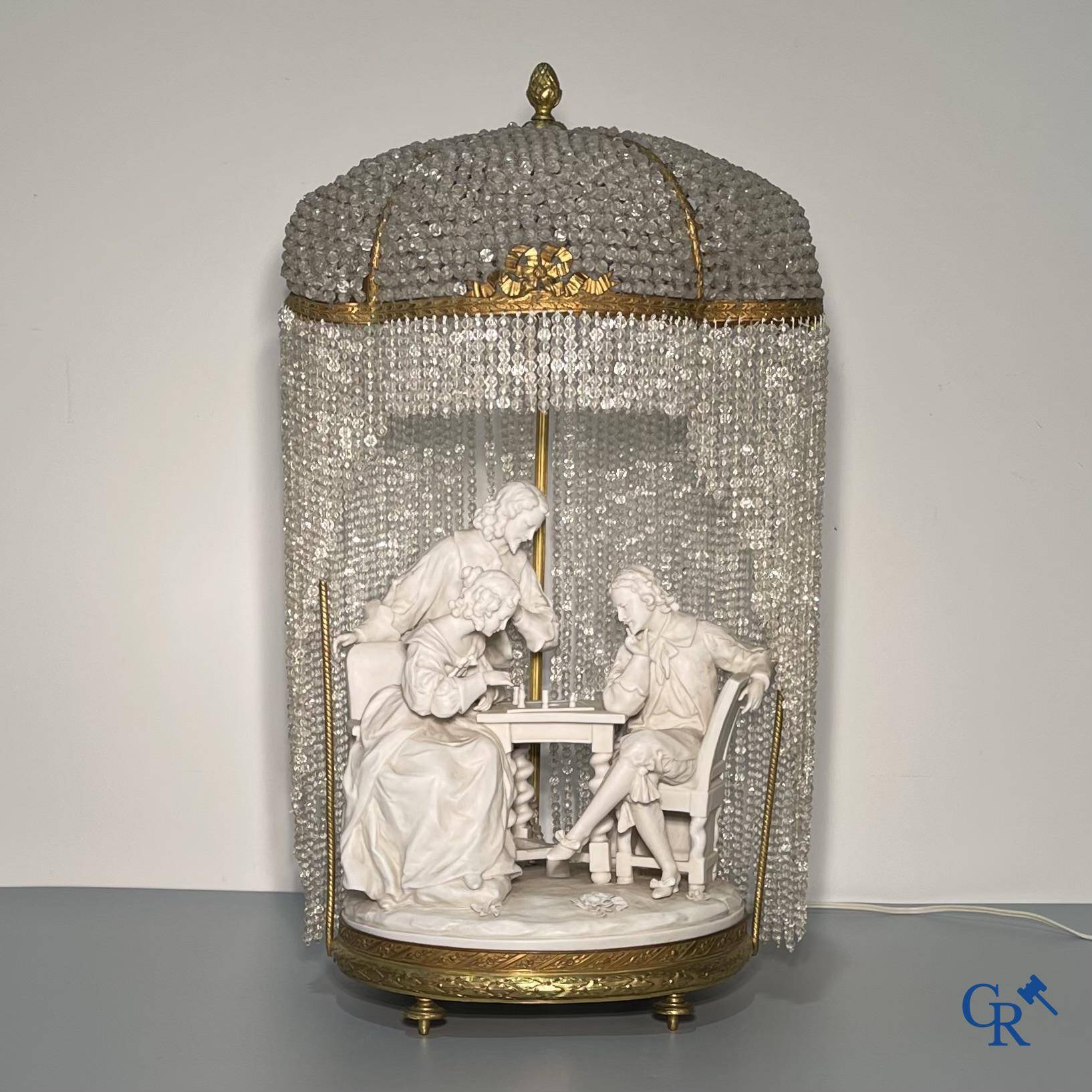 European porcelain, Karel Ens Volkstedt, a large lamp in biscuit and bronze, LXVI-style. Marked. Around 1920.