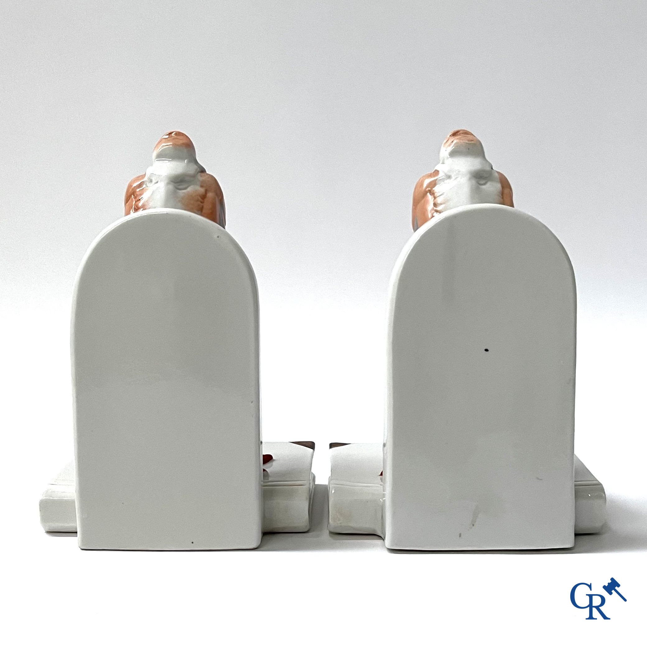 Art Deco, a pair of bookends in polychrome porcelain with a typical Art Deco representation of marabou.