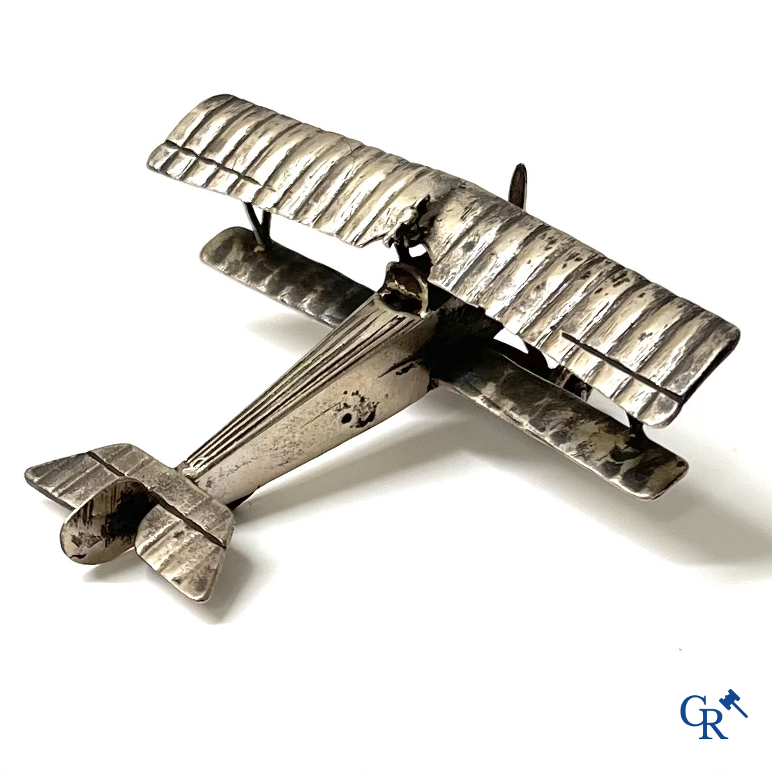 A miniature model of a double-decker aircraft in silver 800°/00. Circa 1930.