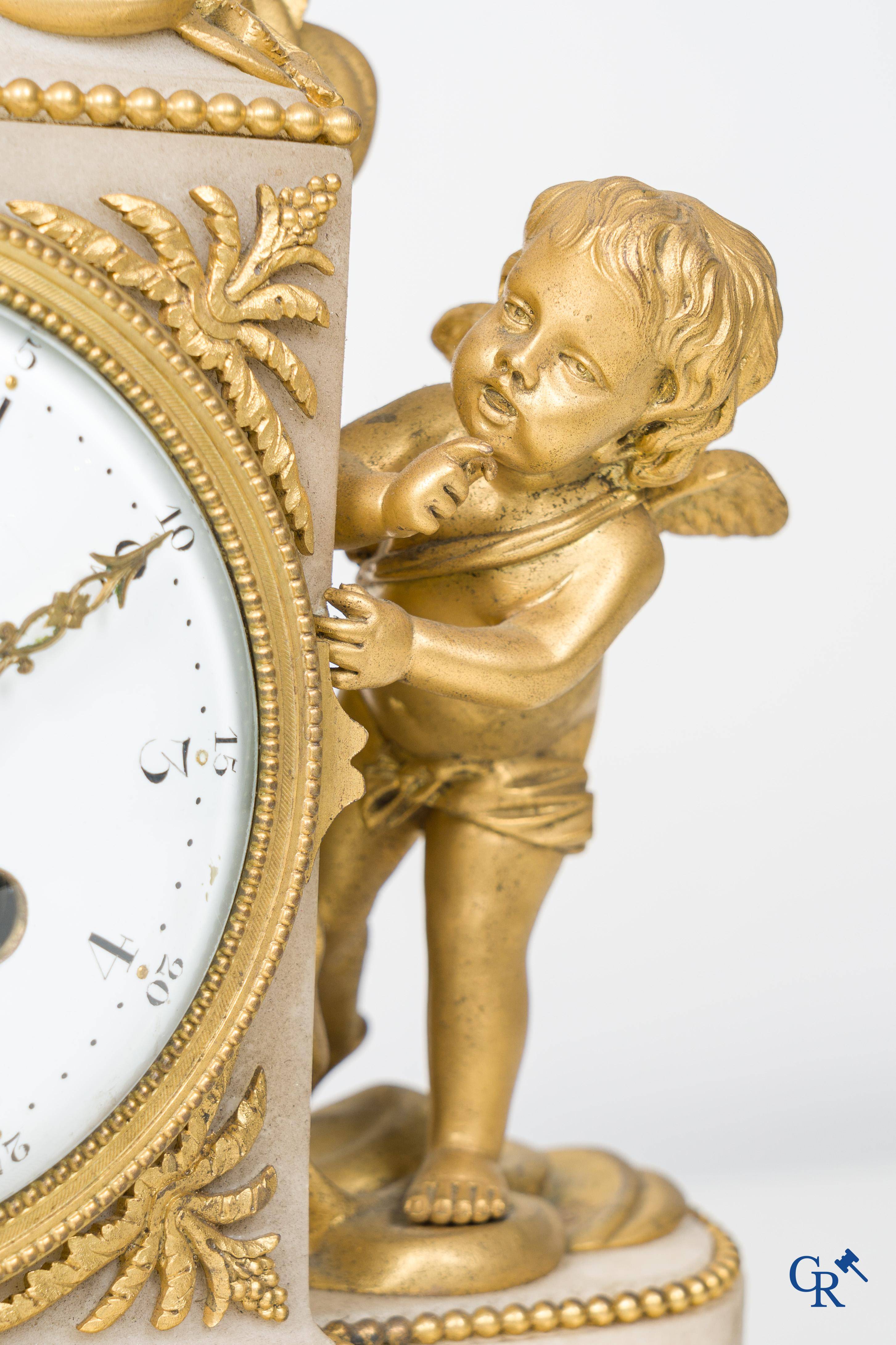A finely chiseled and gilded LXVI-style clock in marble and bronze. circa 1880.