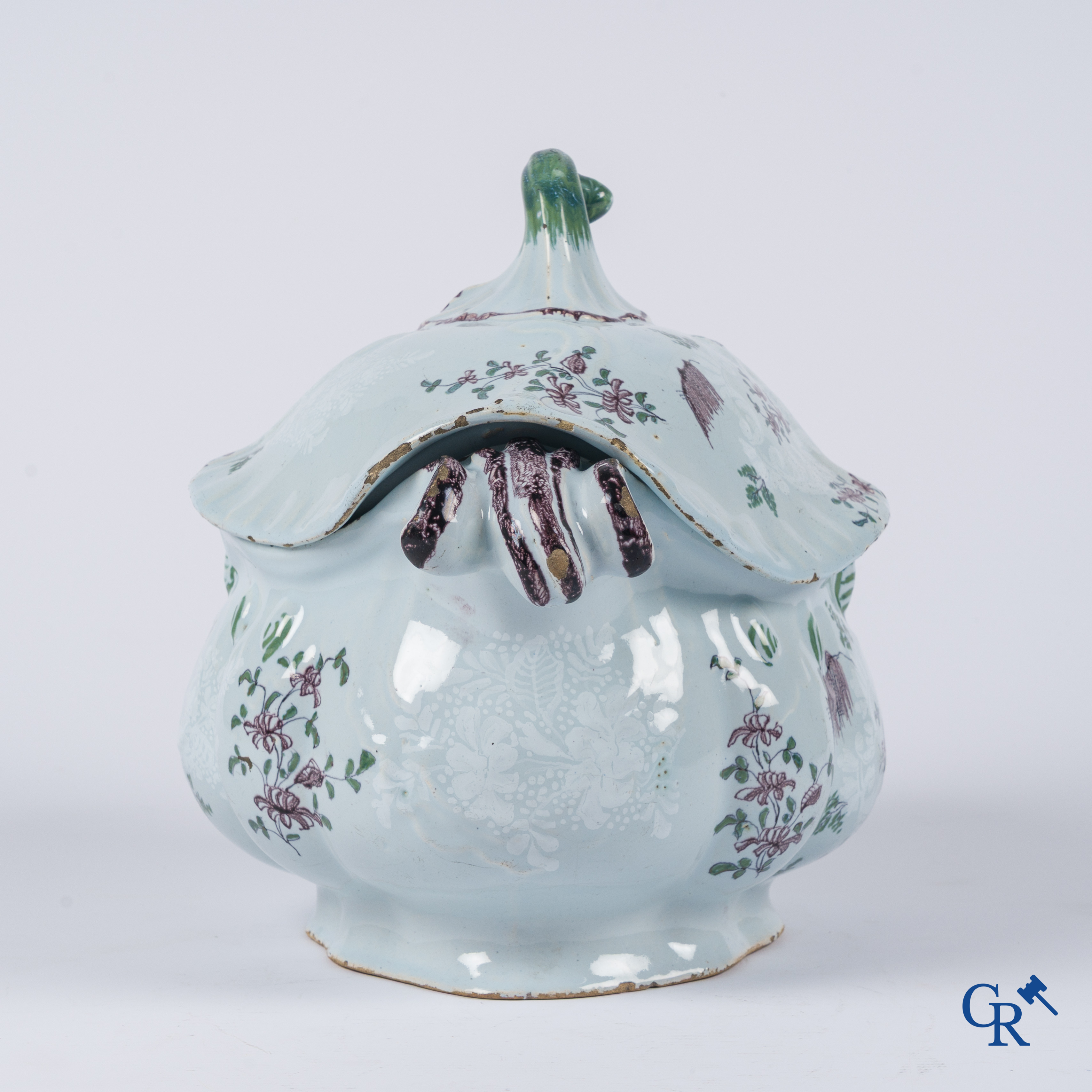 Earthenware. A large 18th century tureen and its lid in enamelled faience.