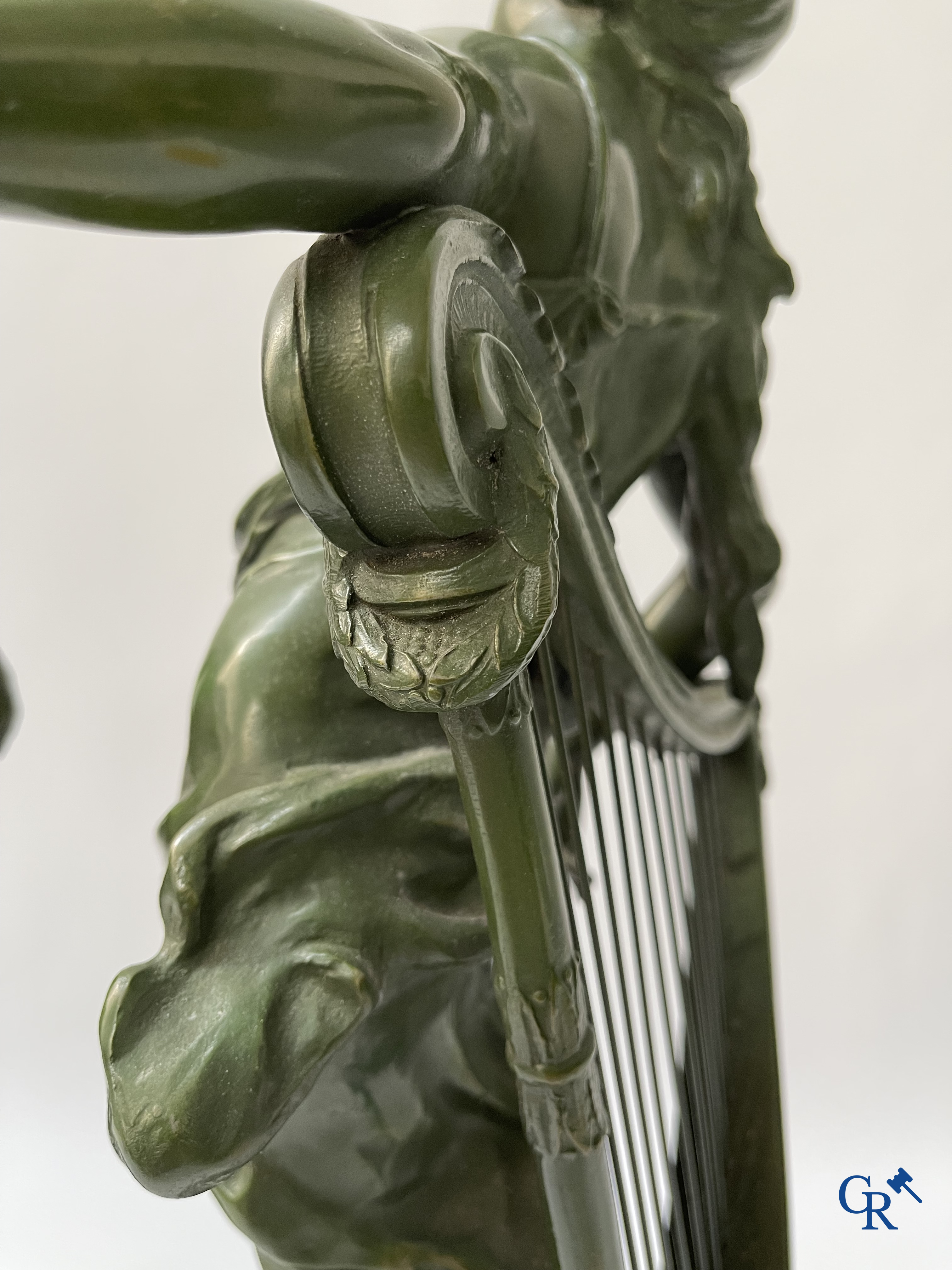 Louis & François Moreau, A large pair of statues in green patinated spelter on a wooden base. Signed L&F Moreau.