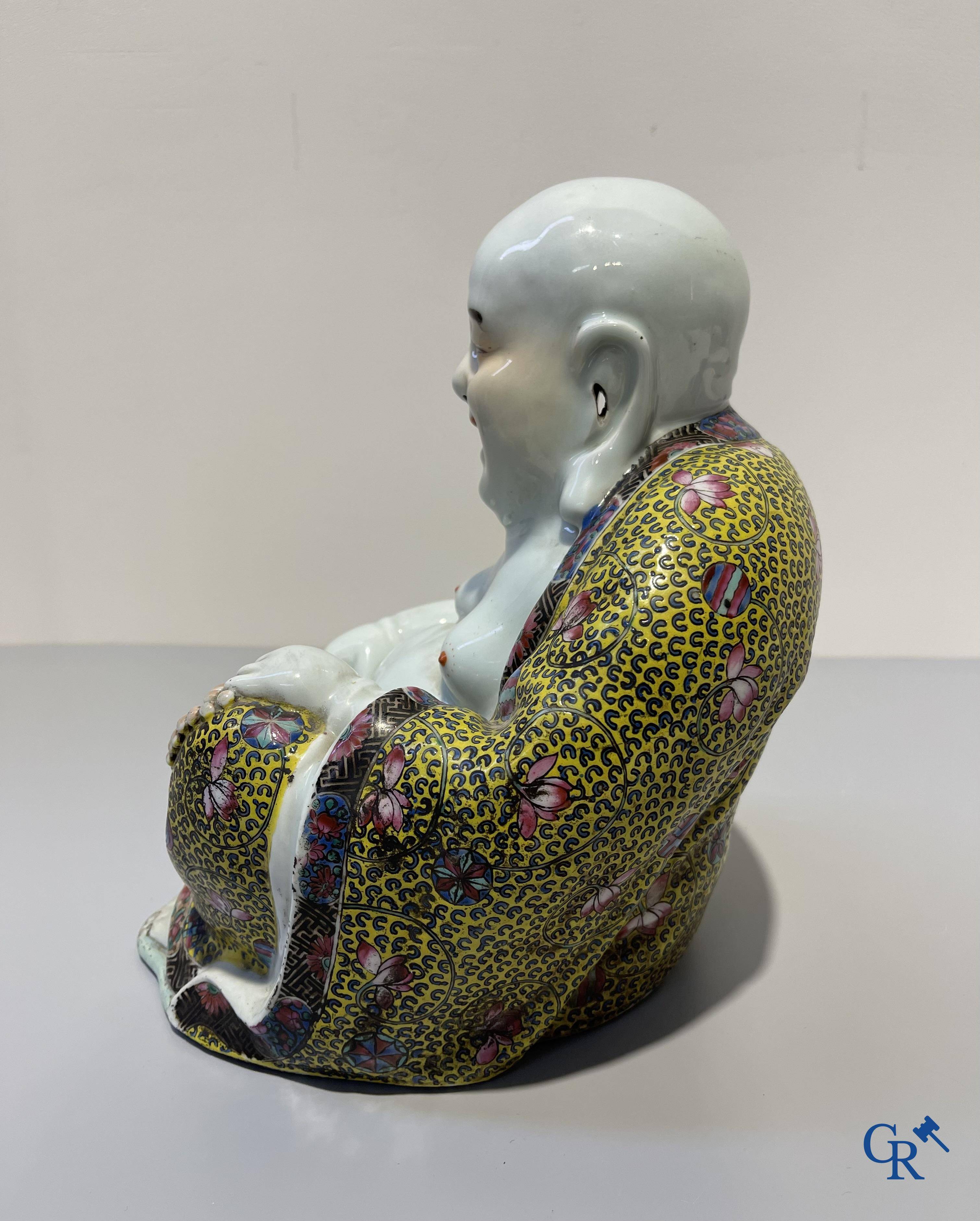 Asian Art, Chinese porcelain. A Chinese famille rose figure of a Buddha with a seal mark. 19th century.