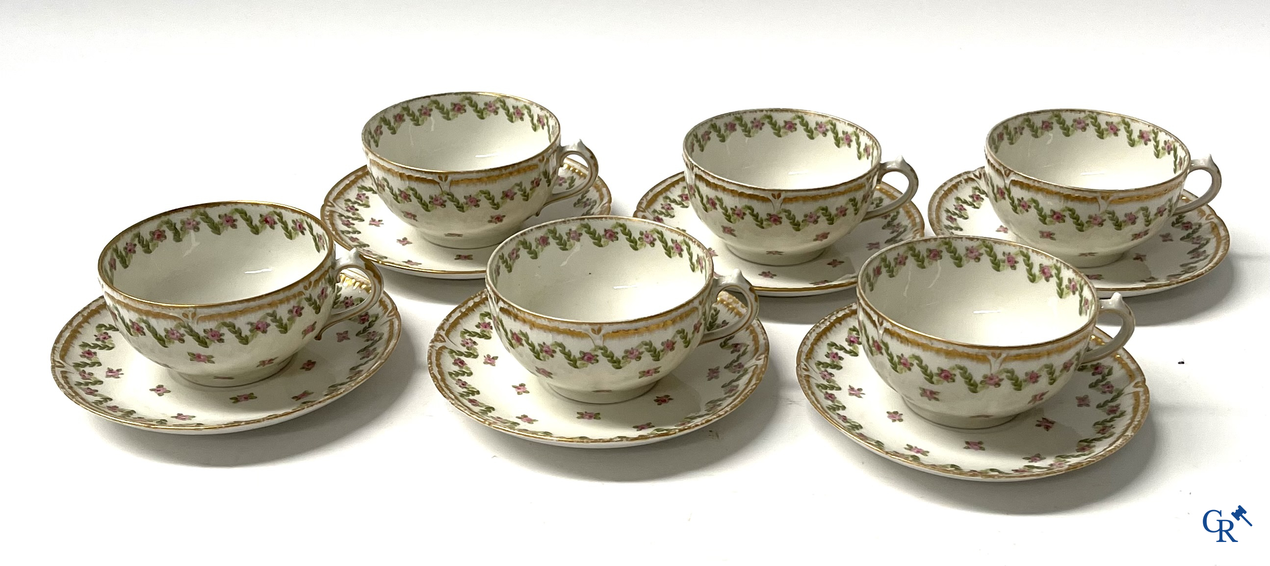 A coffee and tea set with 12 dessert plates in gilded and polychrome decorated French porcelain. Around 1900.