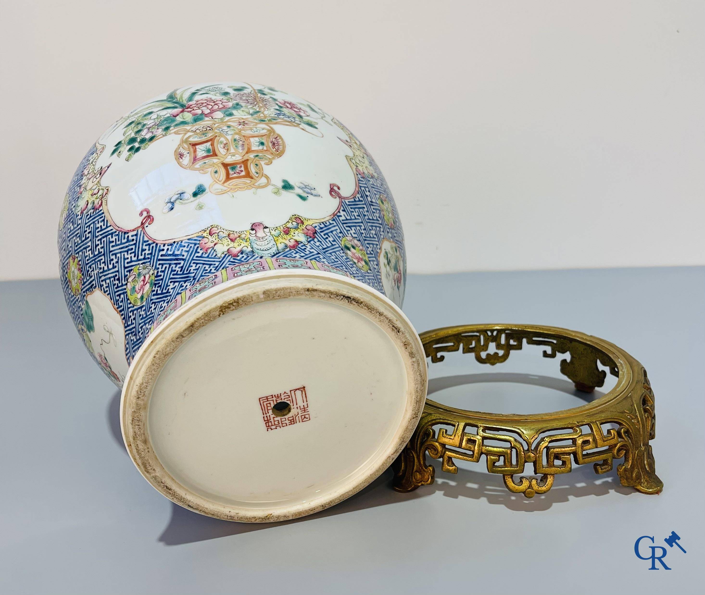 Asian Art, Chinese porcelain, a finely decorated Chinese famille rose vase with bronze. 19th century.