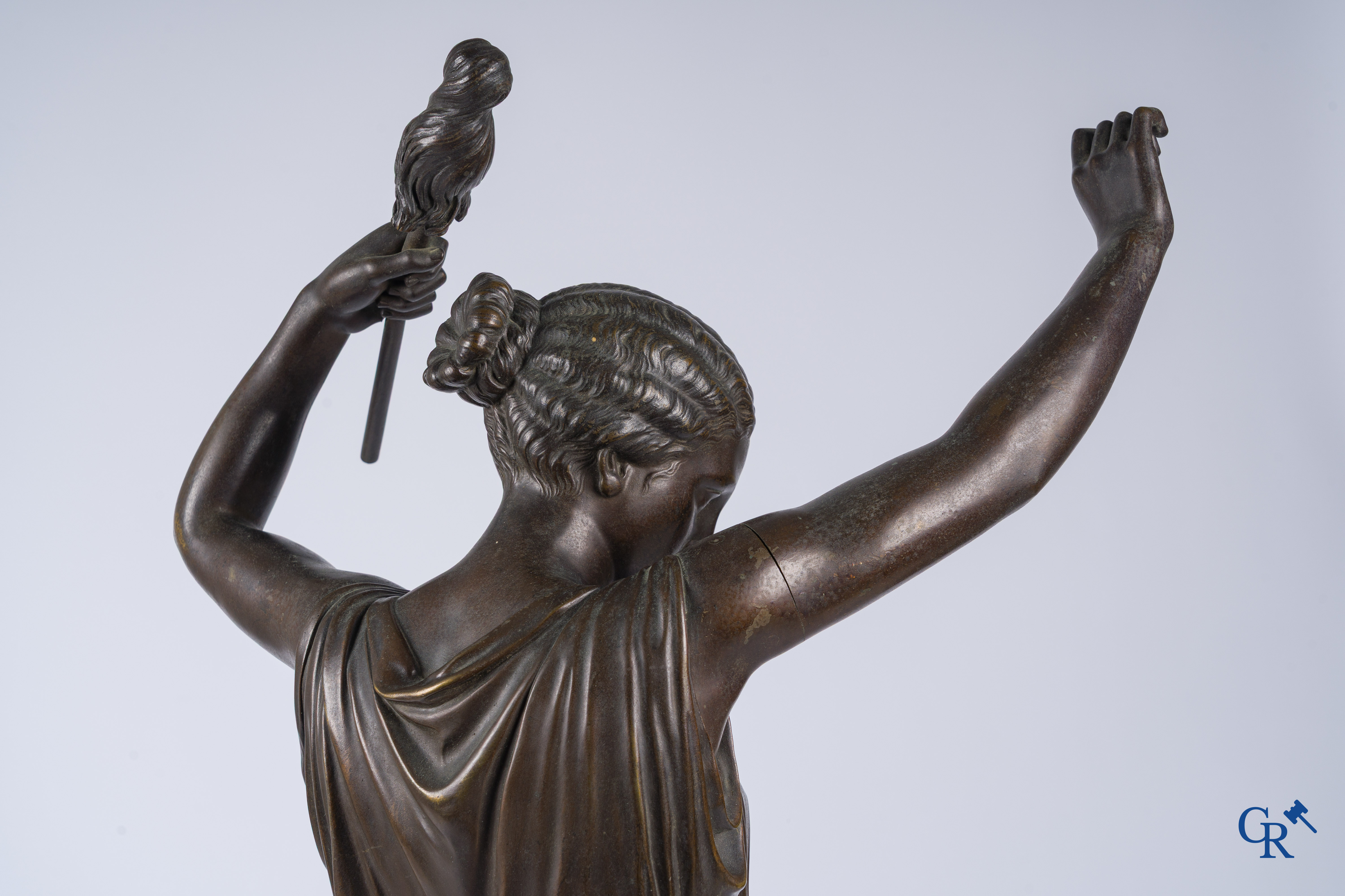 Louis Léon Cugnot (1835-1894) A large 3-piece bronze chimney set "La Fileuse" Signed L. Cugnot.