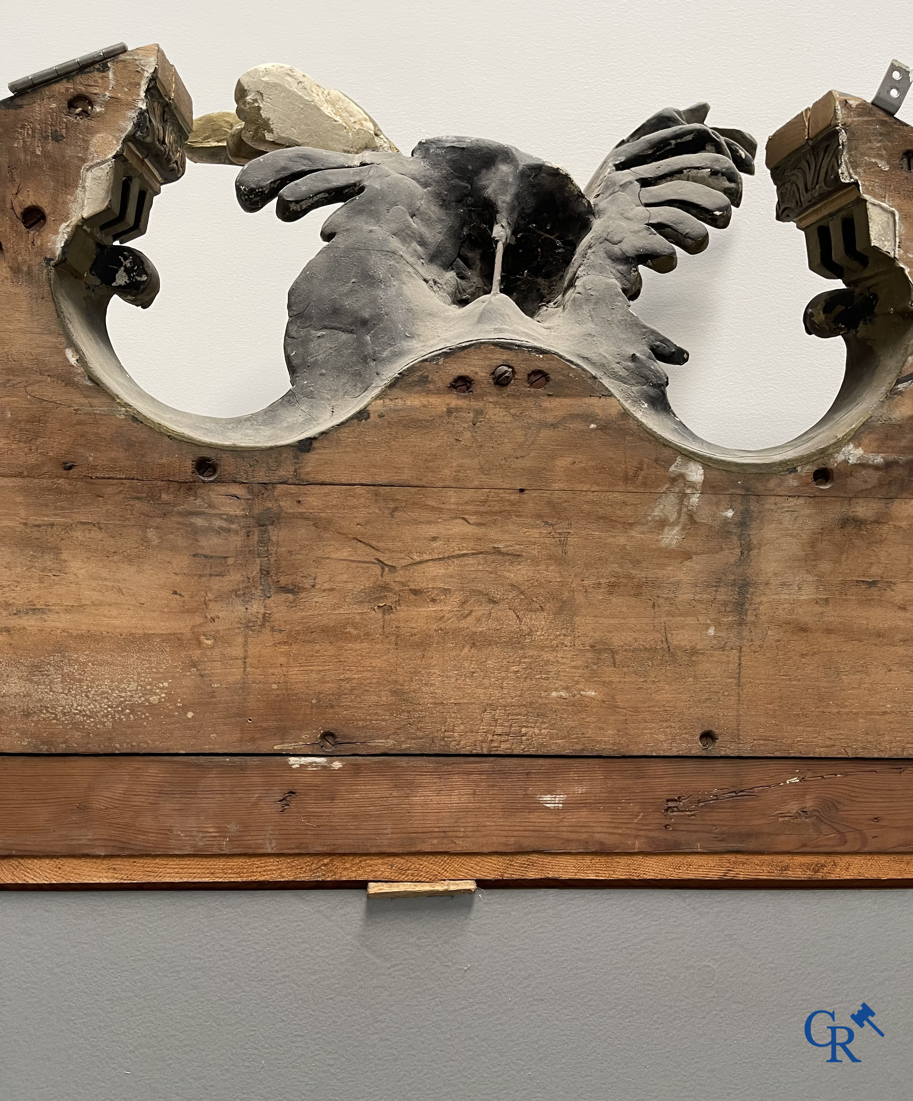 A large patinated fireplace mirror with a dragon. Around 1900.