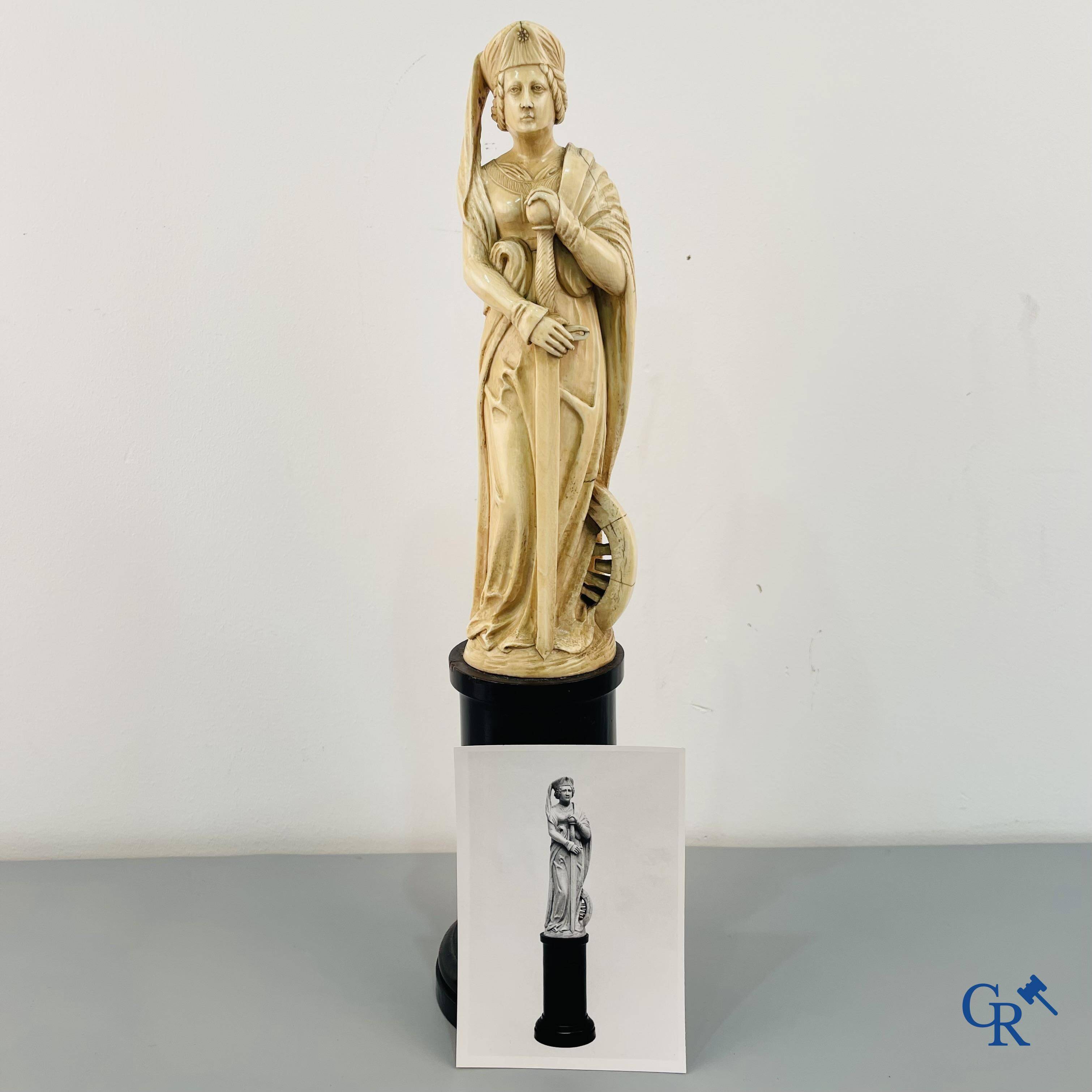 Dieppe, French work, early 19th century. Representation of Catherine of Alexandria in ivory on a pedestal.