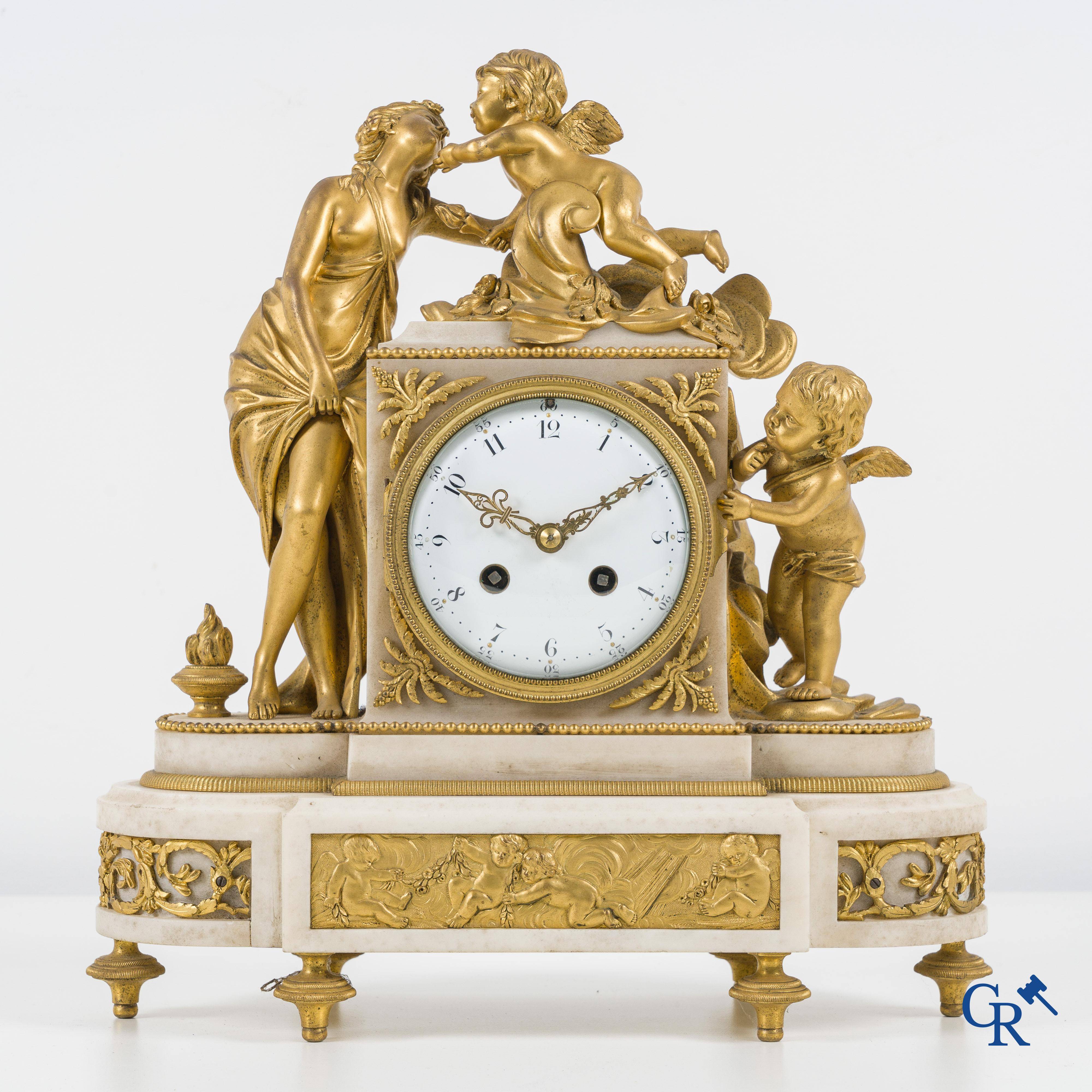 A finely chiseled and gilded LXVI-style clock in marble and bronze. circa 1880.