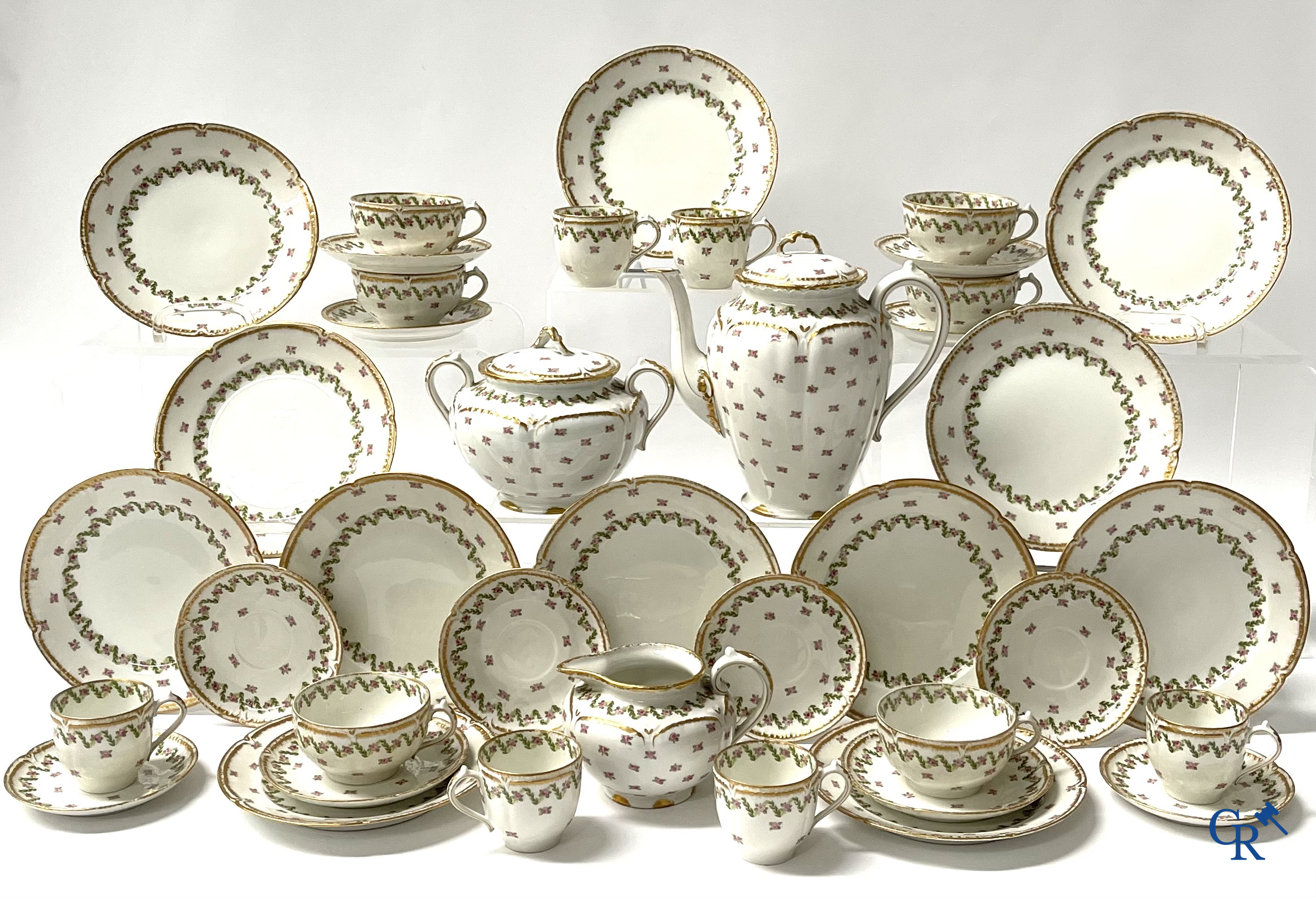 A coffee and tea set with 12 dessert plates in gilded and polychrome decorated French porcelain. Around 1900.