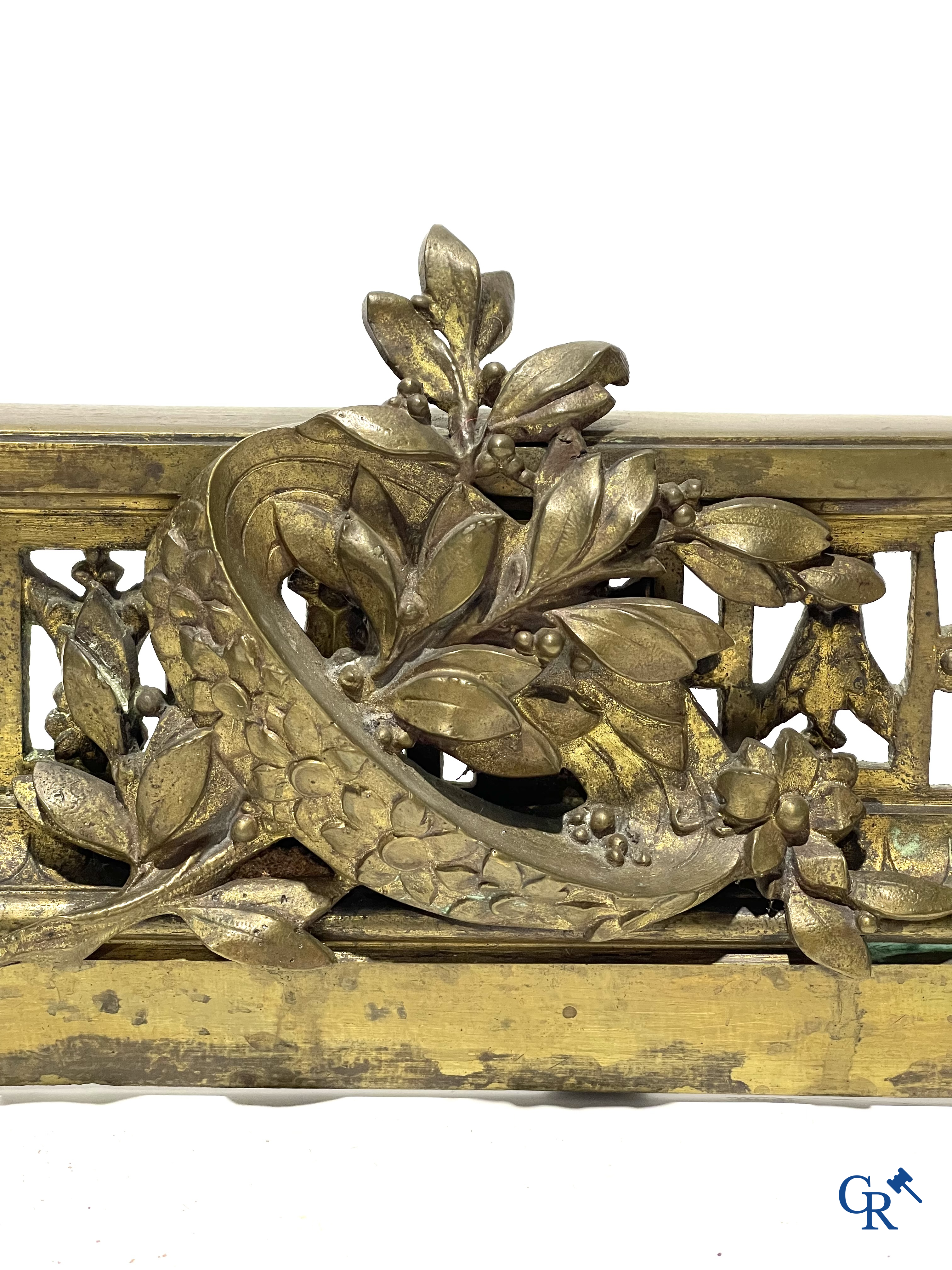 A lot of an imposing chandelier with 12 light points, a lamp belge with bronze frame and a fireplace piece.