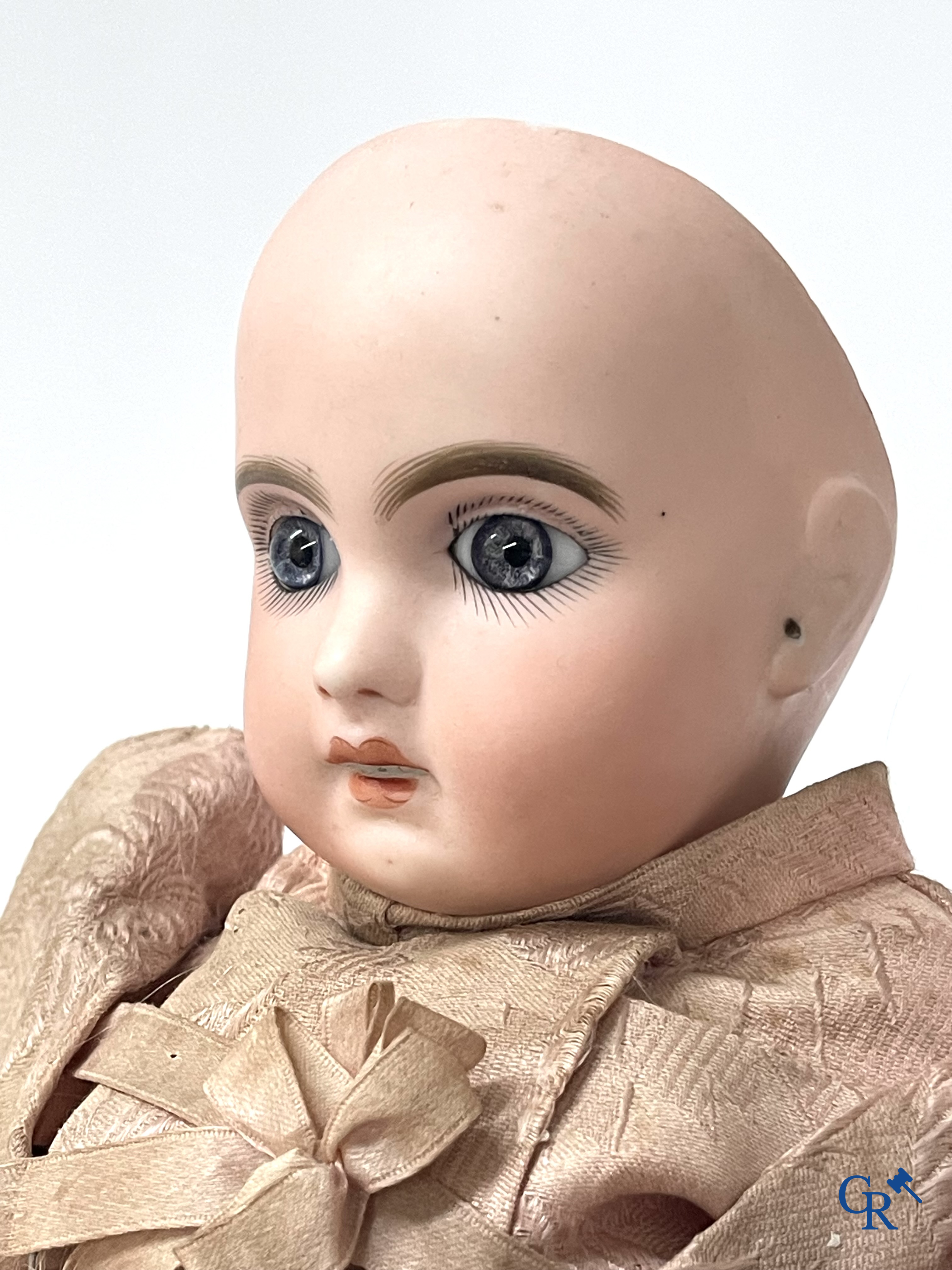 Old toys. Jumeau doll with porcelain head. Numbered 8, original clothing and shoes.