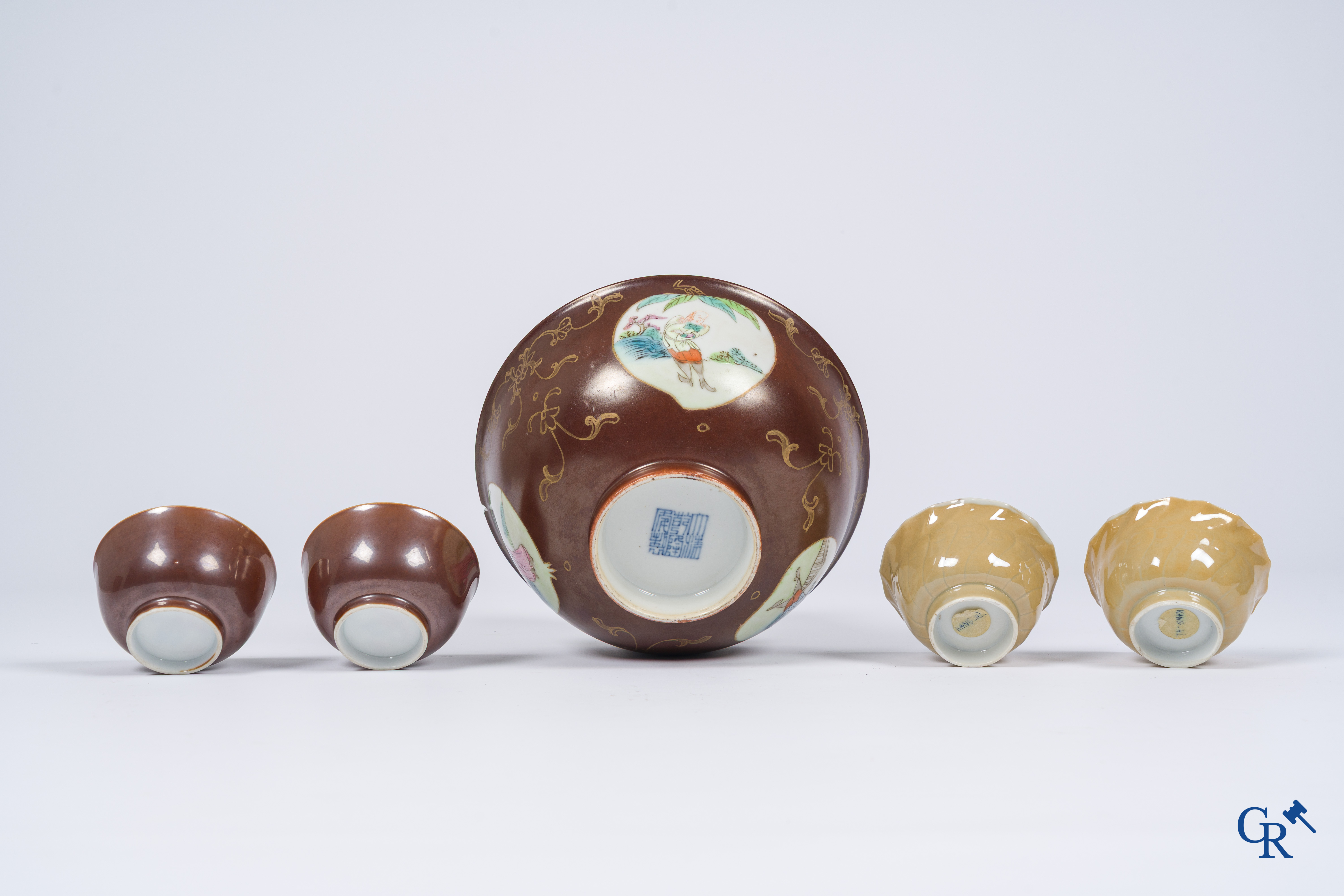 Asian Art, Chinese porcelain. A large Chinese "café au lait" bowl and saucer. 4 cups with saucers attached.