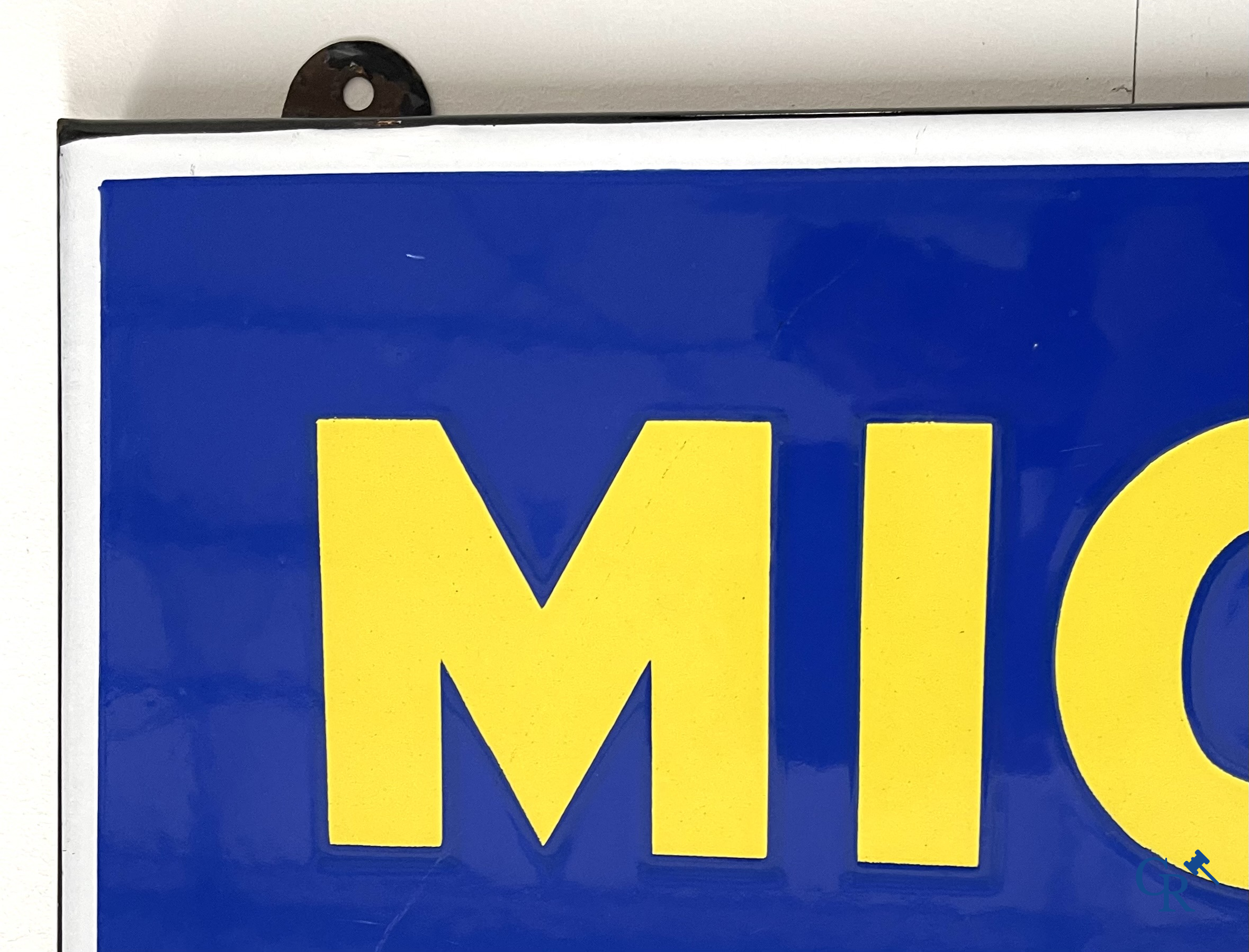 Michelin, Large enamel advertising sign of the running Bibendum with tire. Emaillerie Alsacienne Strasbourg.