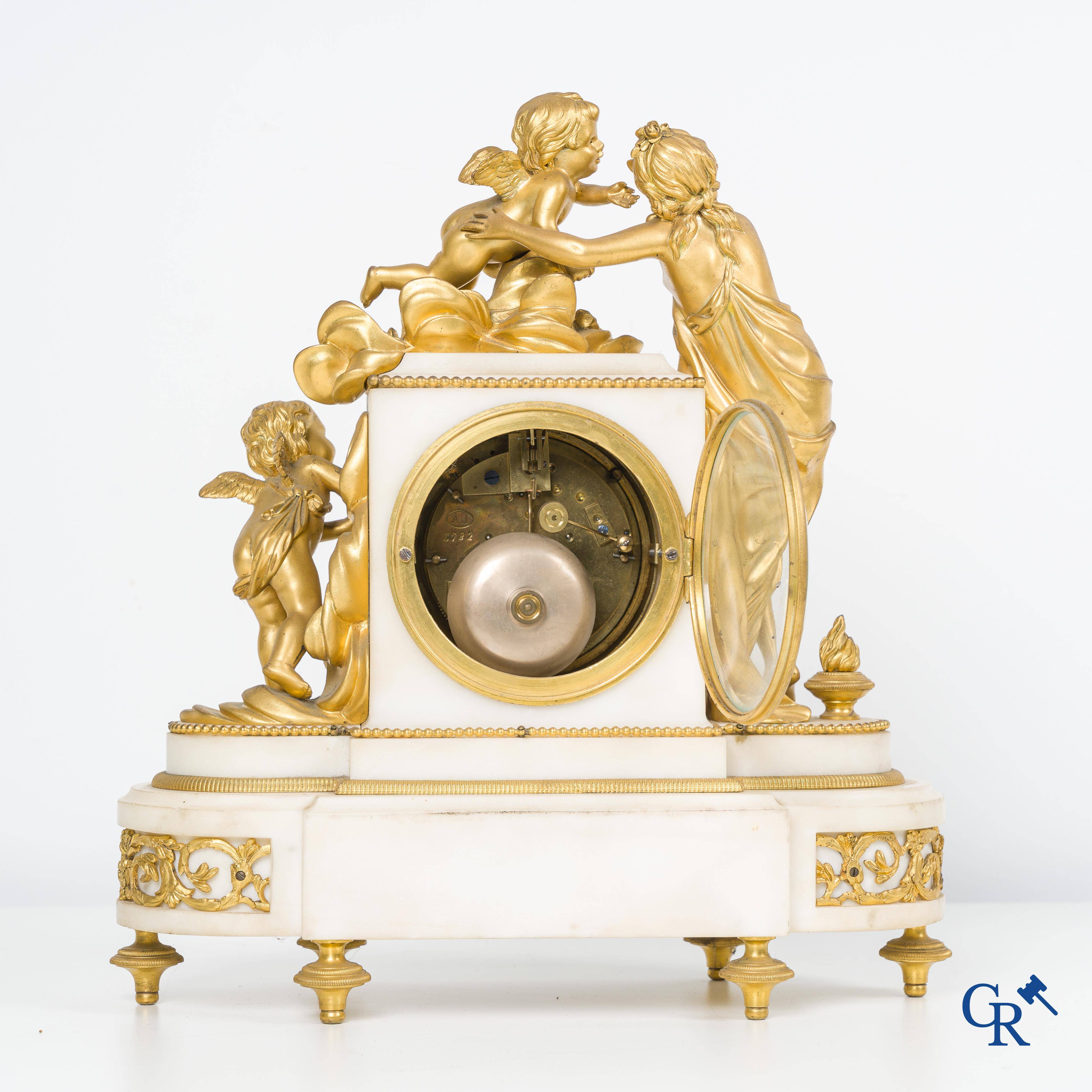 A finely chiseled and gilded LXVI-style clock in marble and bronze. circa 1880.