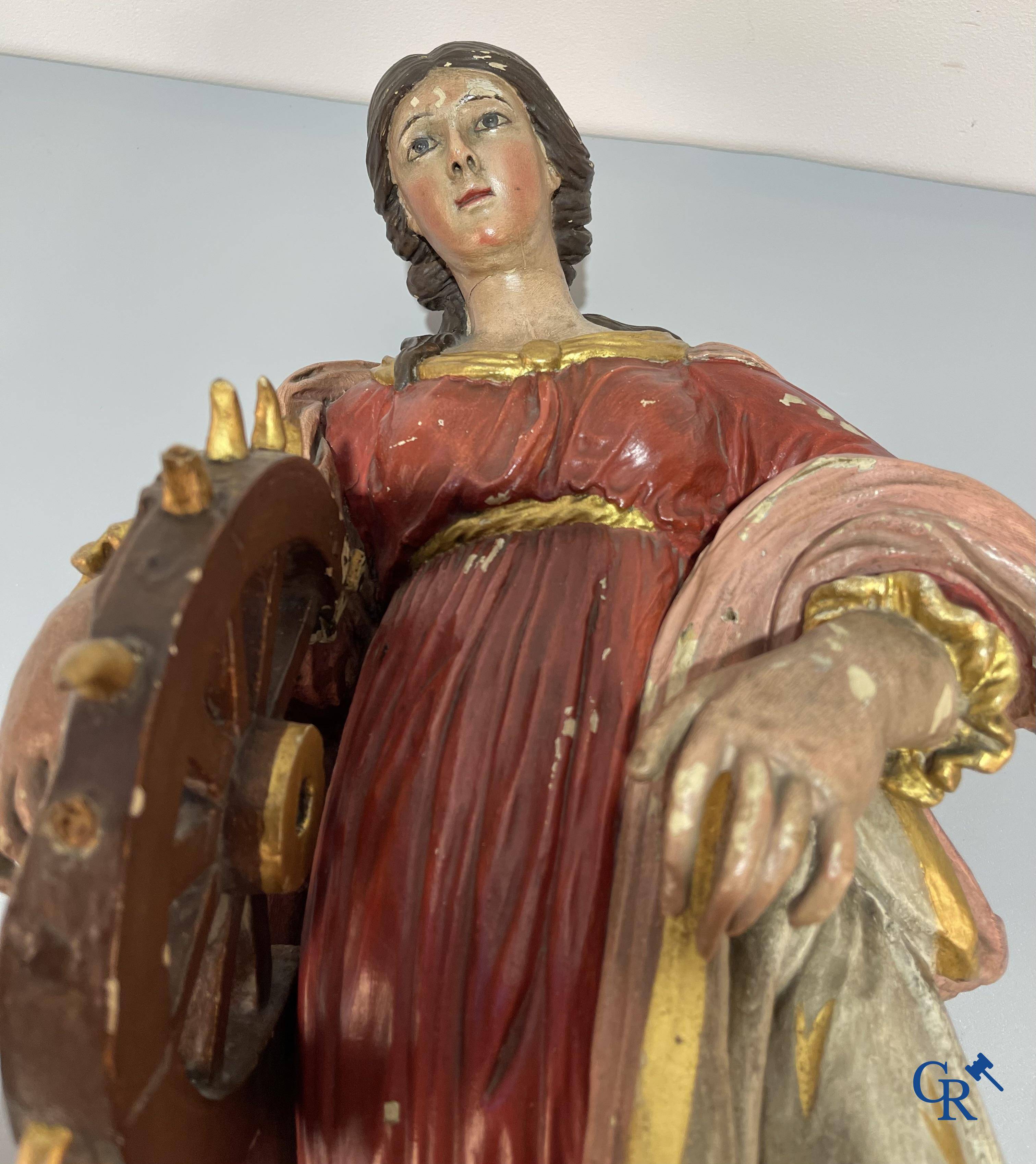 Religious objects, a finely carved and polychrome wooden statue of Saint Catherine in Baroque style. 18th century.