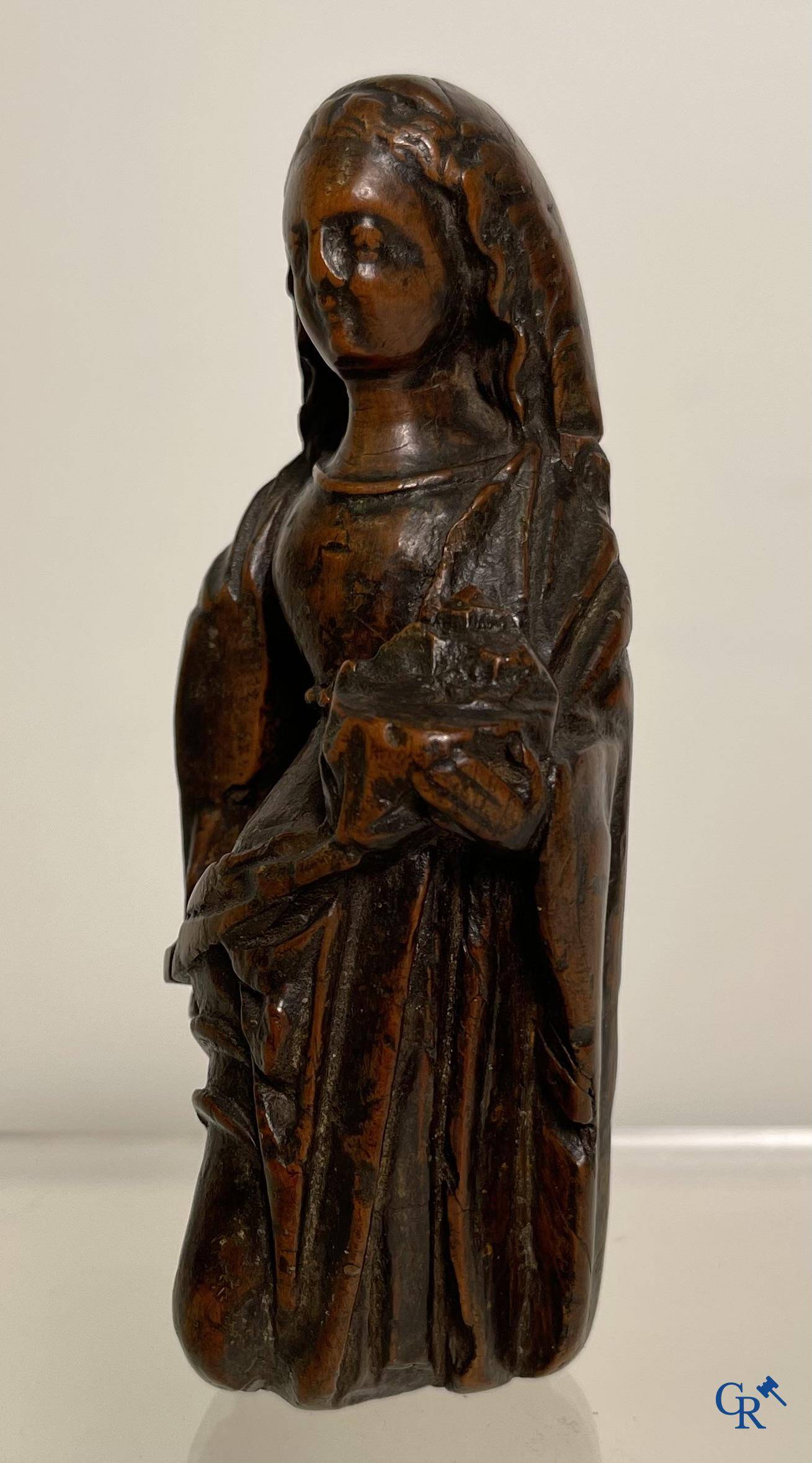 2 religious fragments in palm wood and lime wood. 16th-17th century.