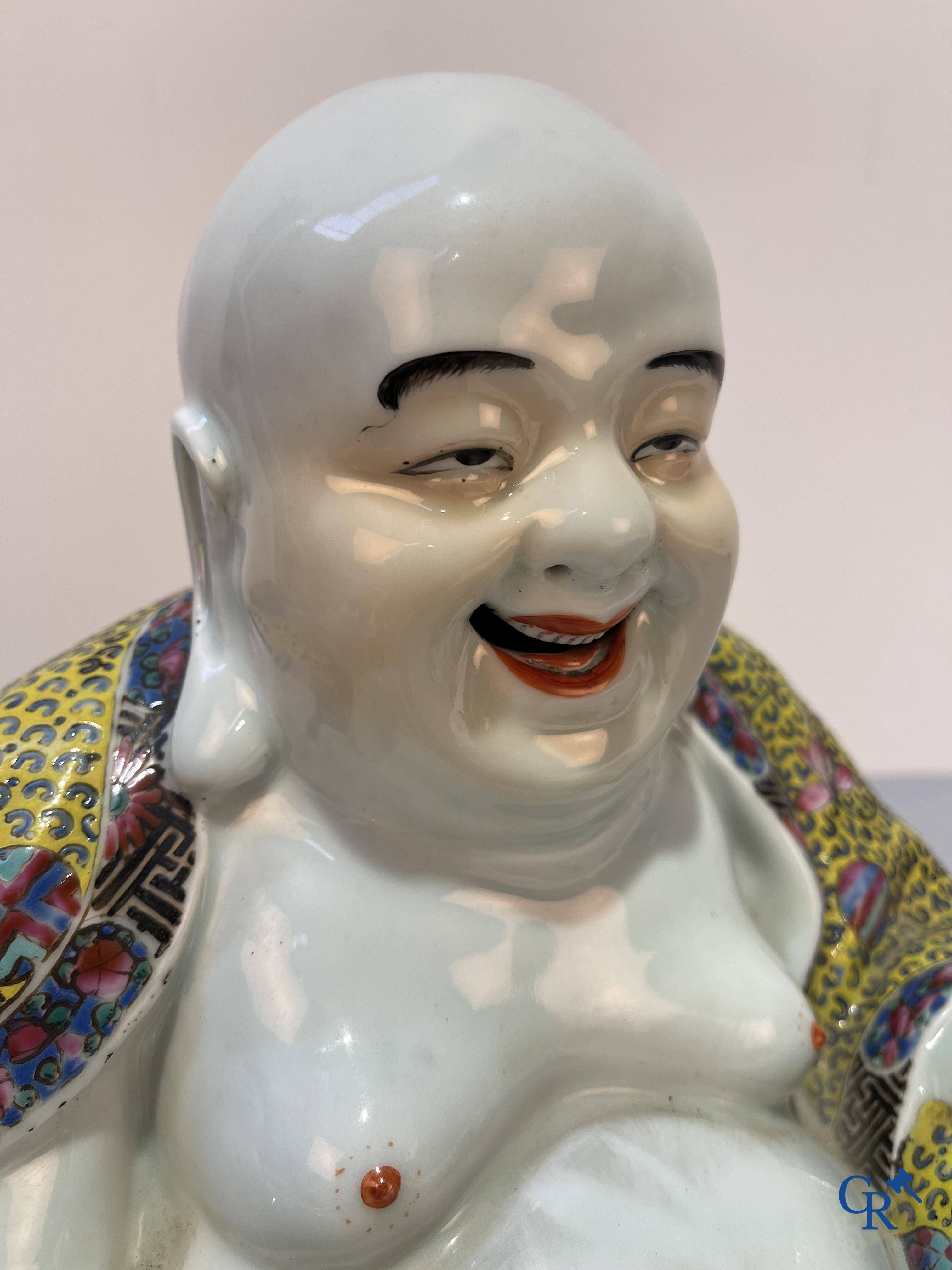 Asian Art, Chinese porcelain. A Chinese famille rose figure of a Buddha with a seal mark. 19th century.