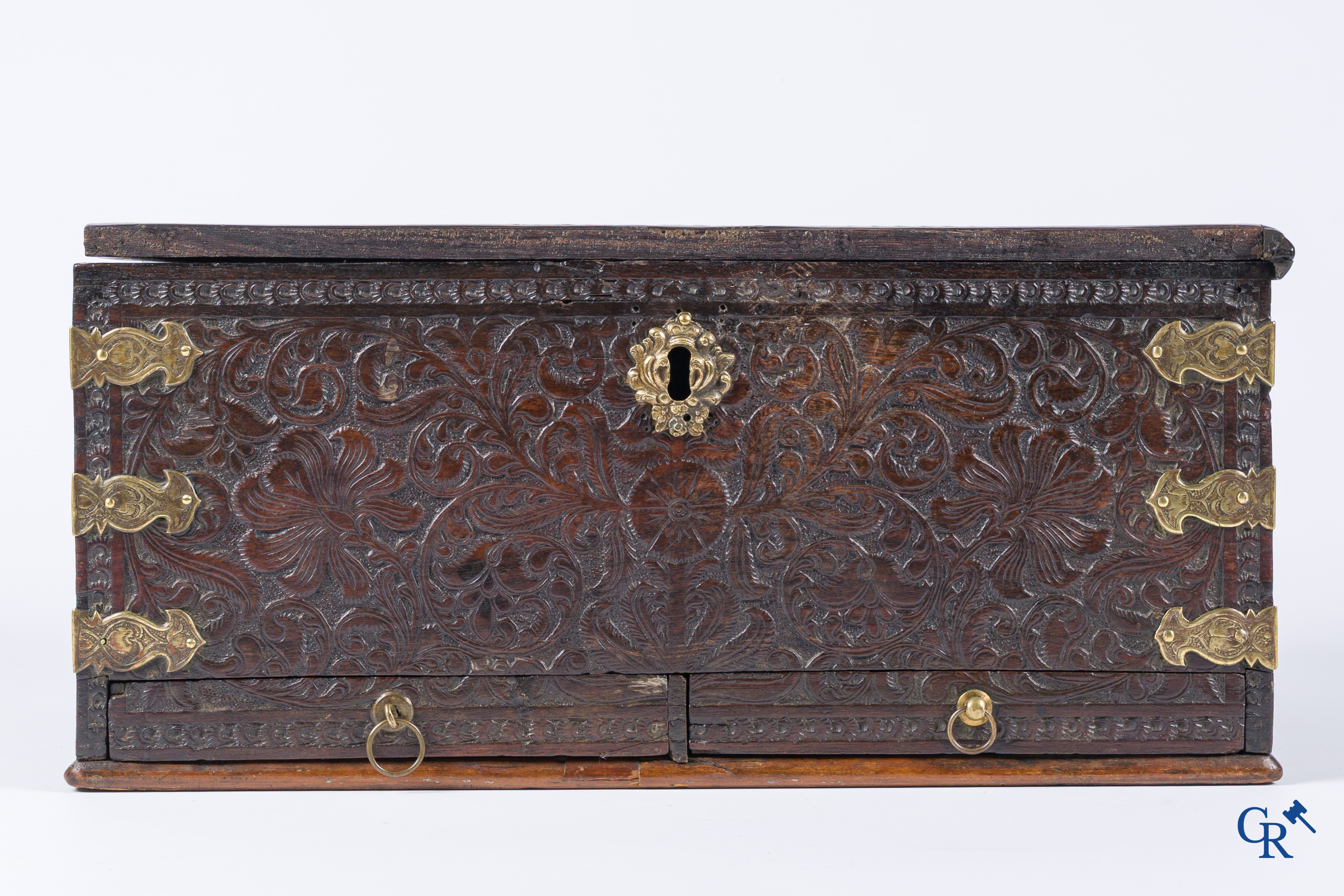 A finely carved colonial small trunk in exotic wood and bronze mounts. 17th-18th century.