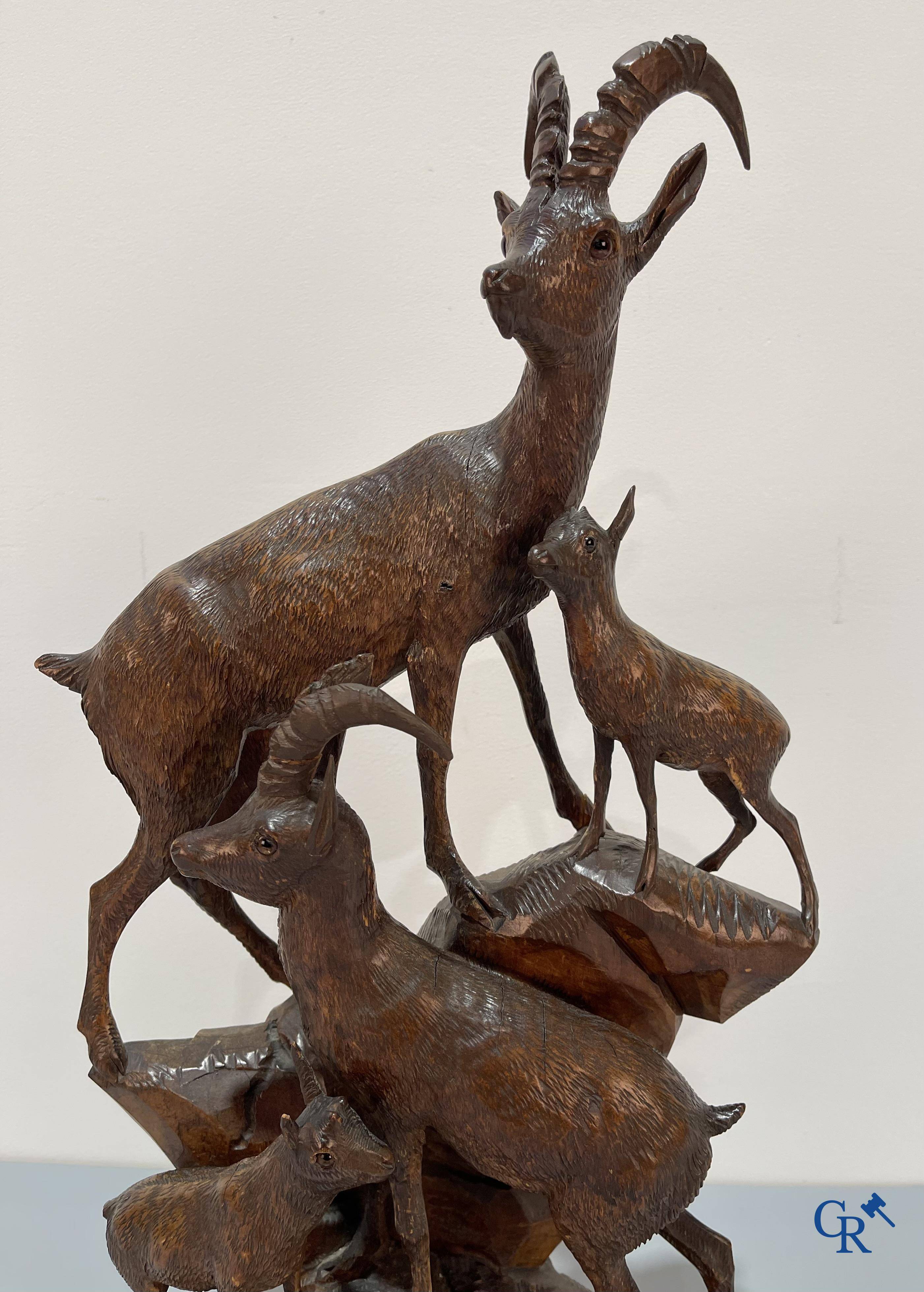 A Black Forest wood sculpture with capricorns, Germany circa 1900.