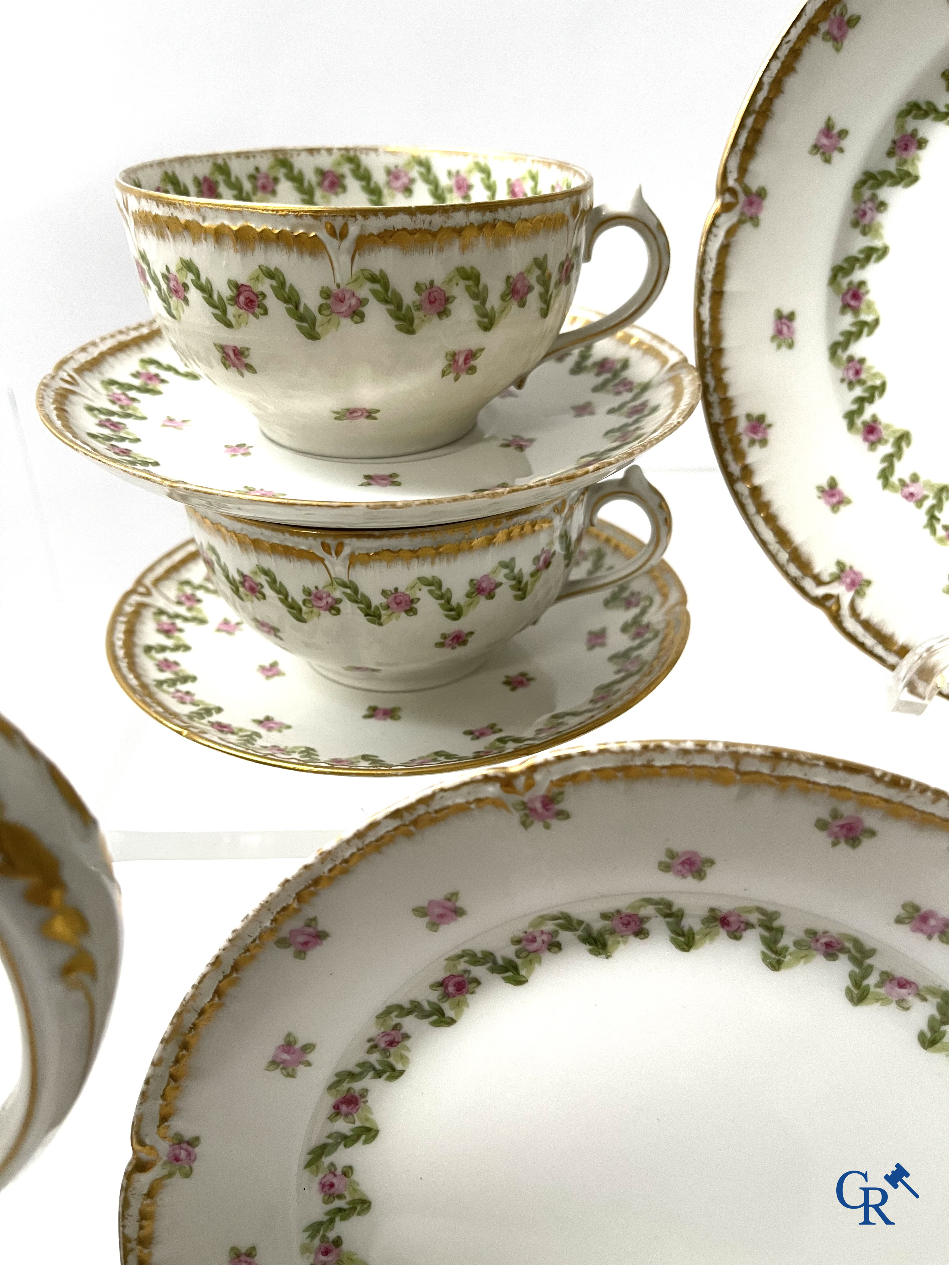 A coffee and tea set with 12 dessert plates in gilded and polychrome decorated French porcelain. Around 1900.