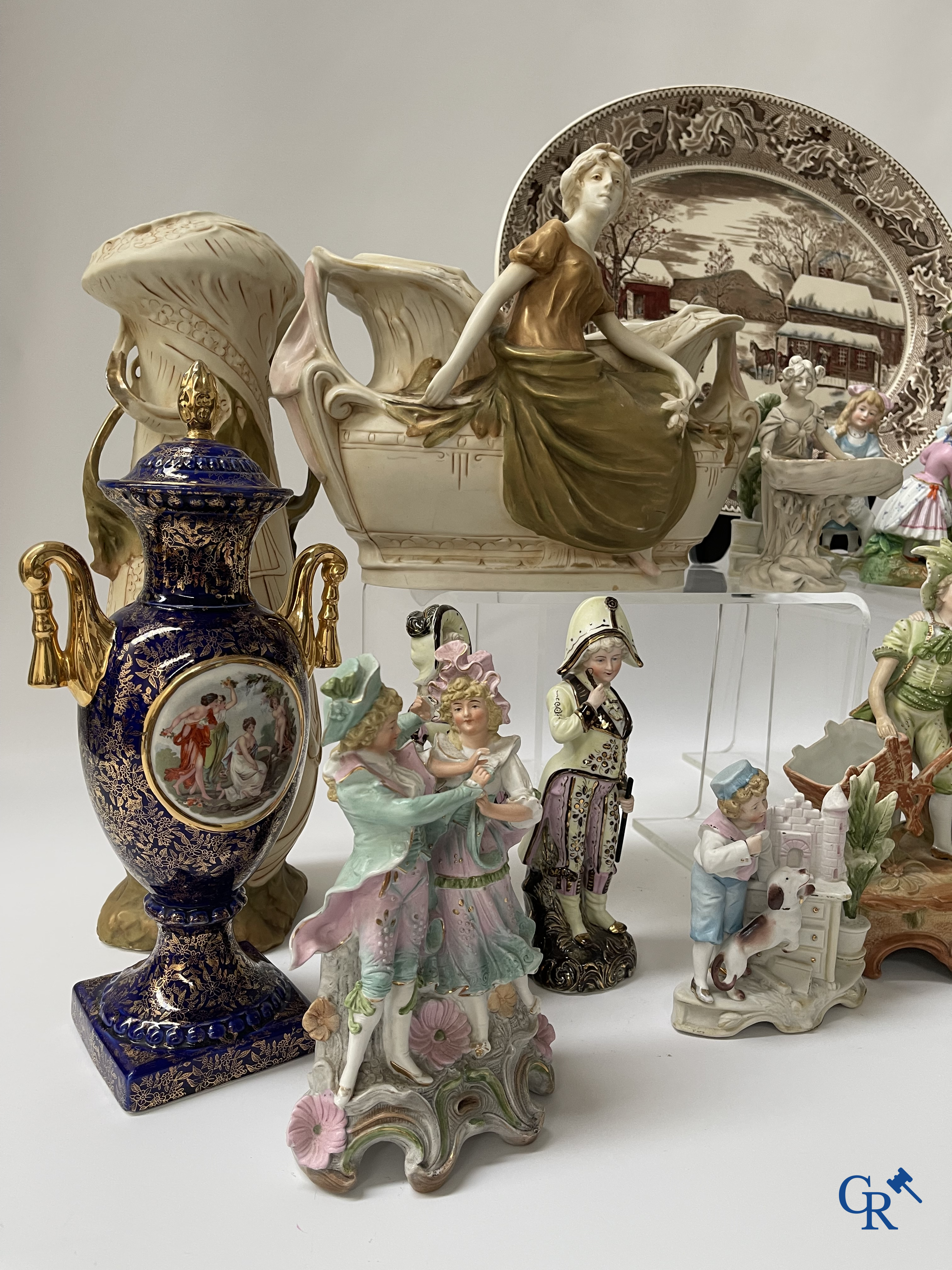 A large lot of brocante including Royal Dux, Biscuit statues, porcelain, globes, spelter statues, table lamp, chandelier etc.