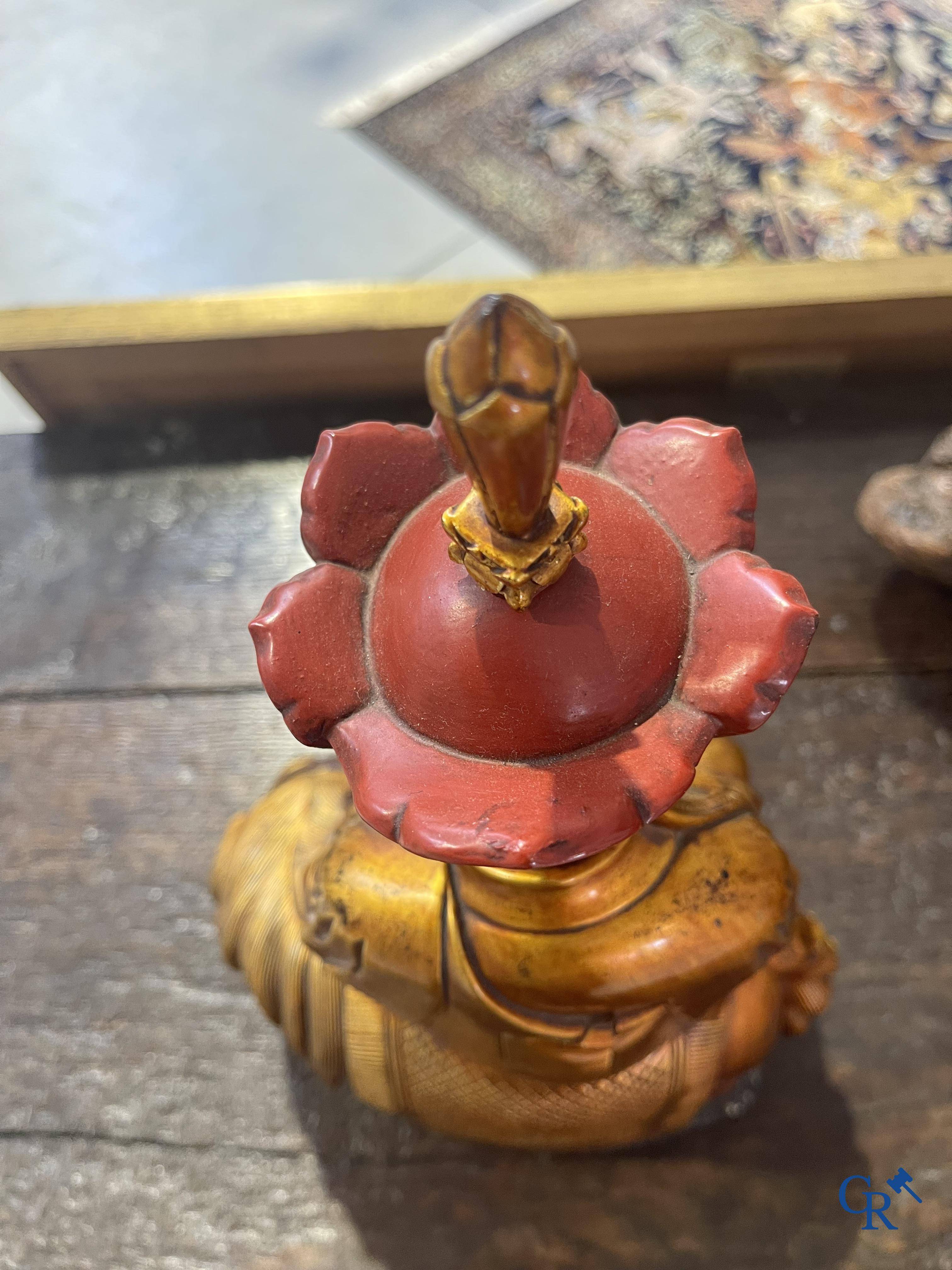 Asian Art: A Chinese sculpture of Vaishravana on a Buddhist lion in lacquered and gilded wood. 19th century.