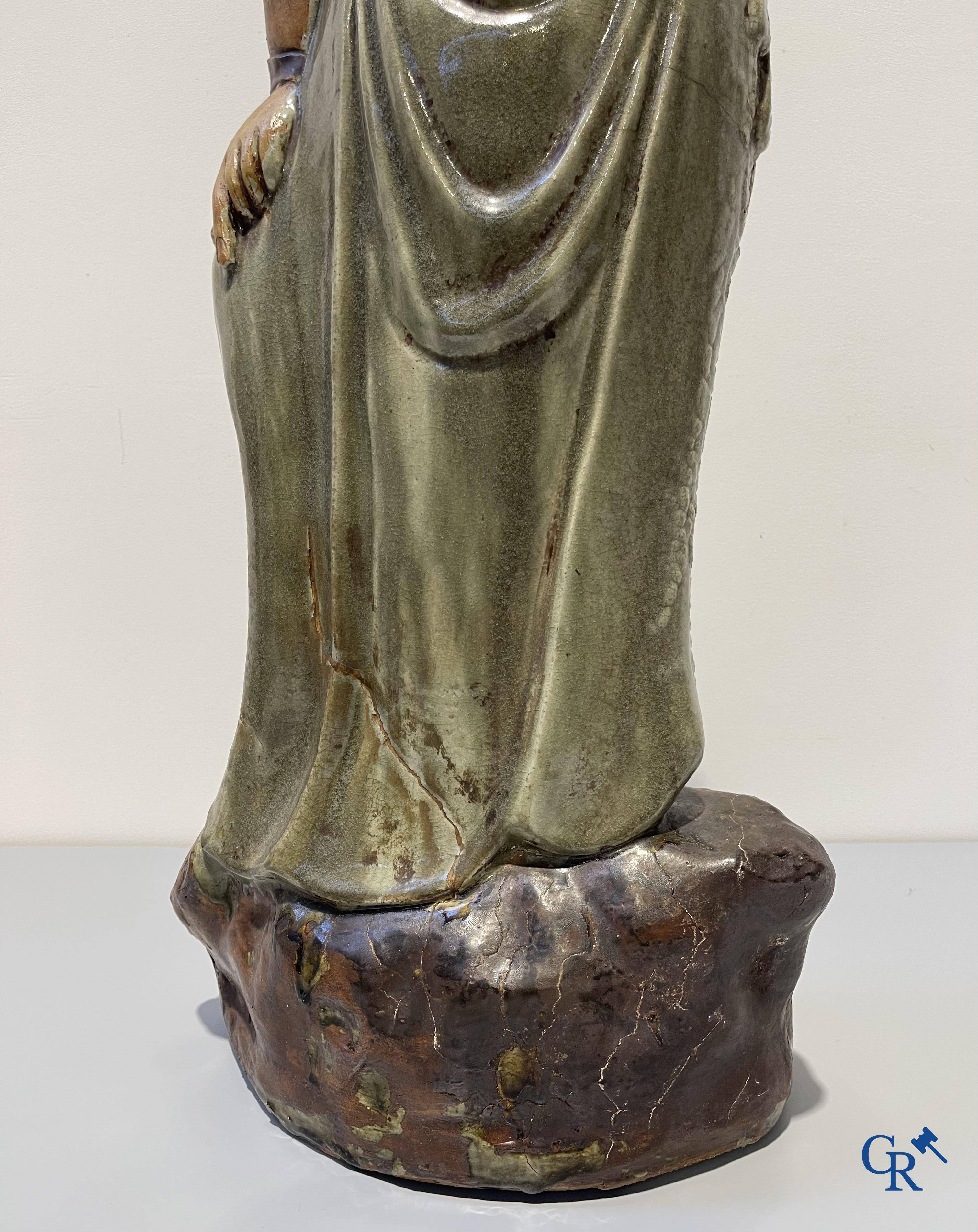 Asian Art, an imposing Shiwan earthenware figure of Guanyin.