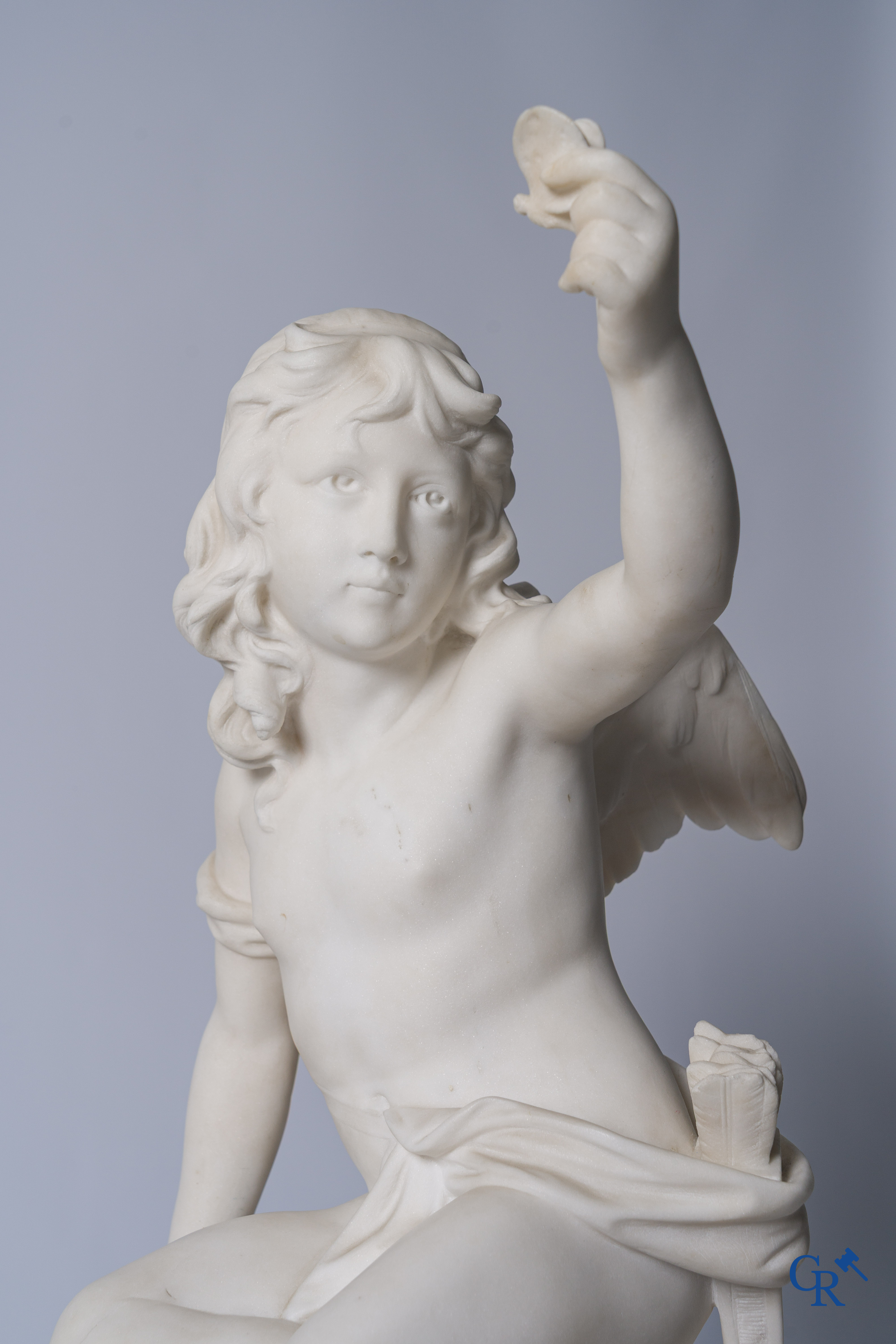 G. Tosi, Beautiful statue in carved marble, seated cupid at wall fountain. Circa 1900.