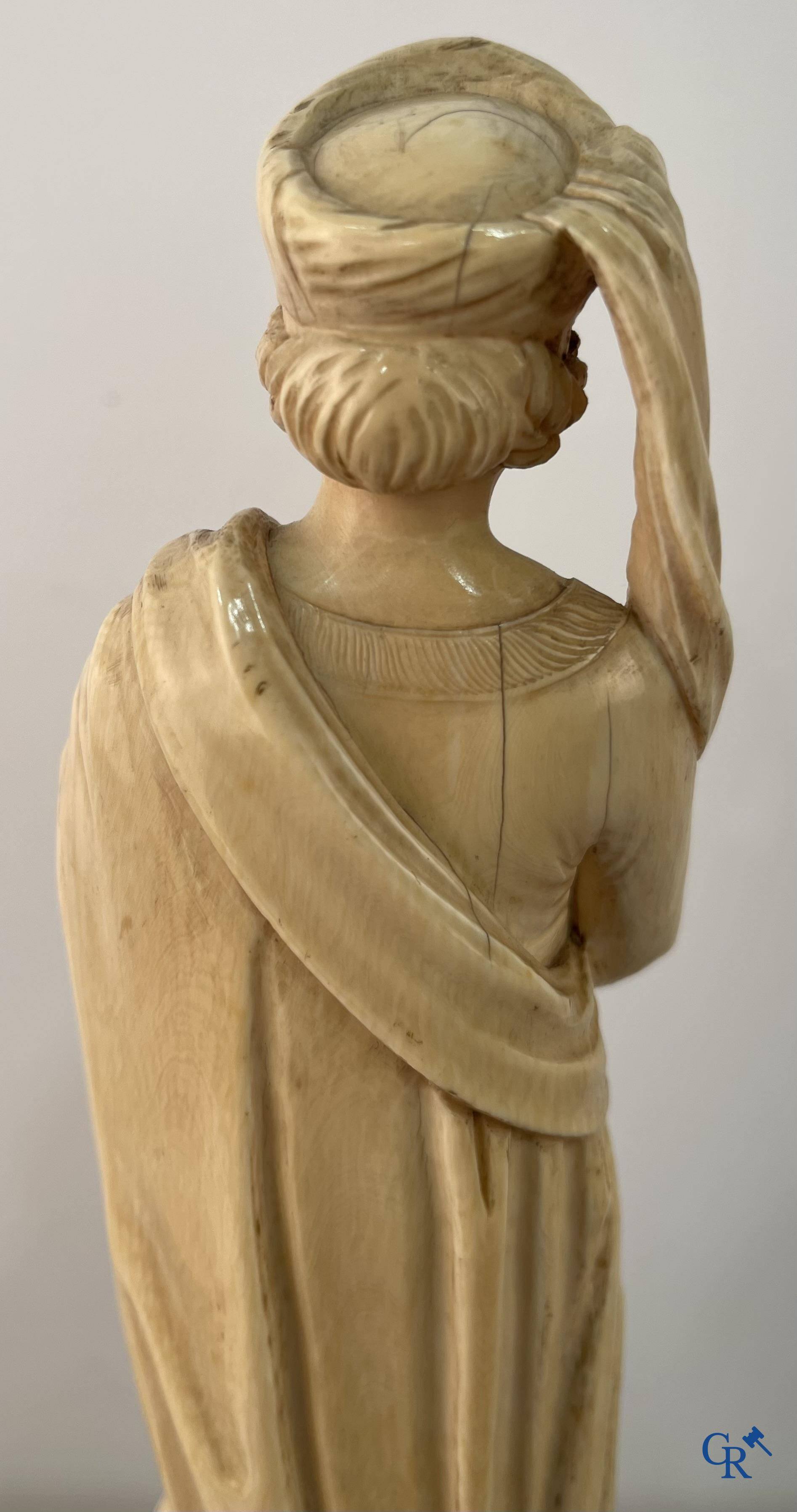 Dieppe, French work, early 19th century. Representation of Catherine of Alexandria in ivory on a pedestal.