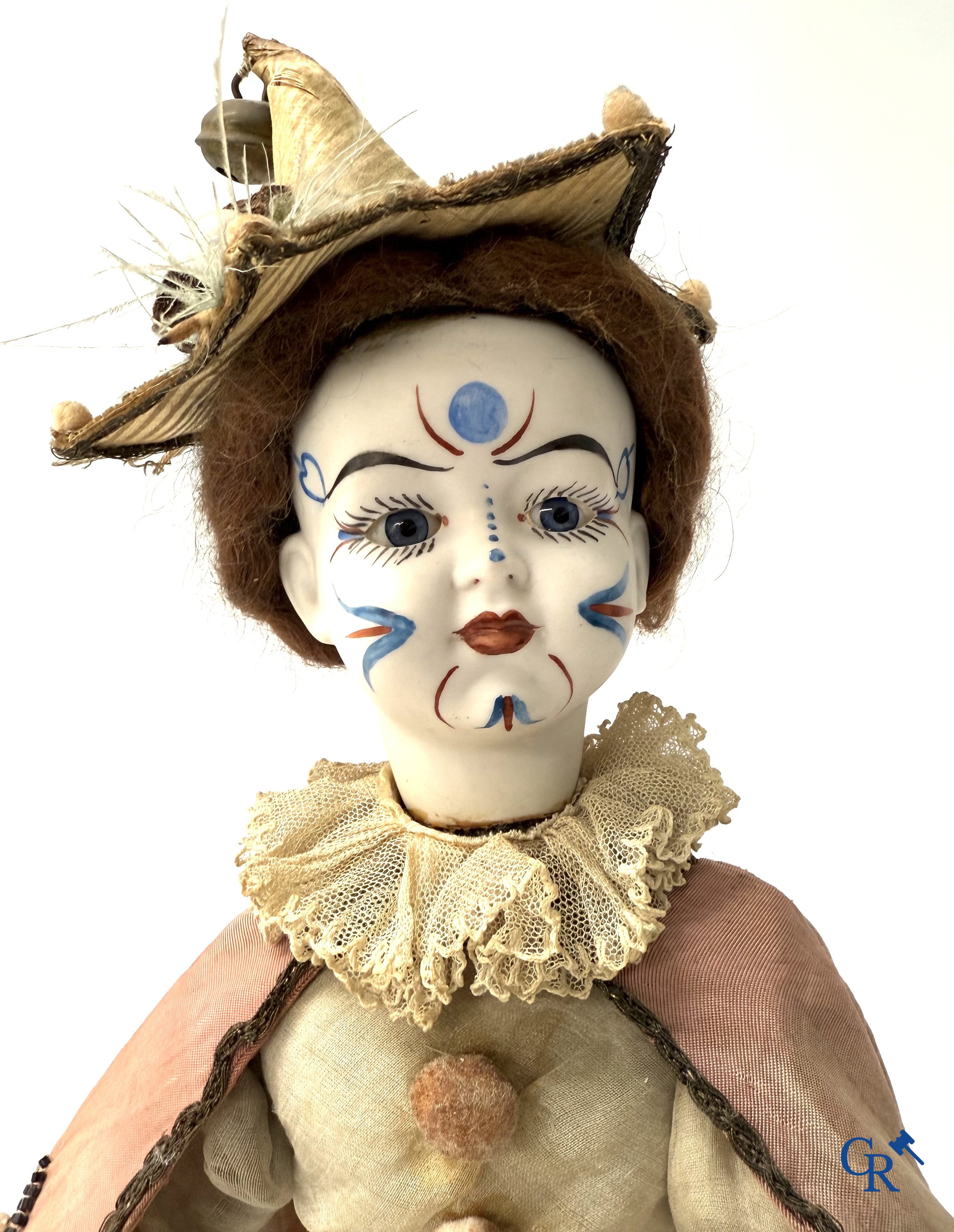 Lambert, Automaat. Clown met bewegingsmechanisme, muziek en porselein hoofd. Circa 1900.