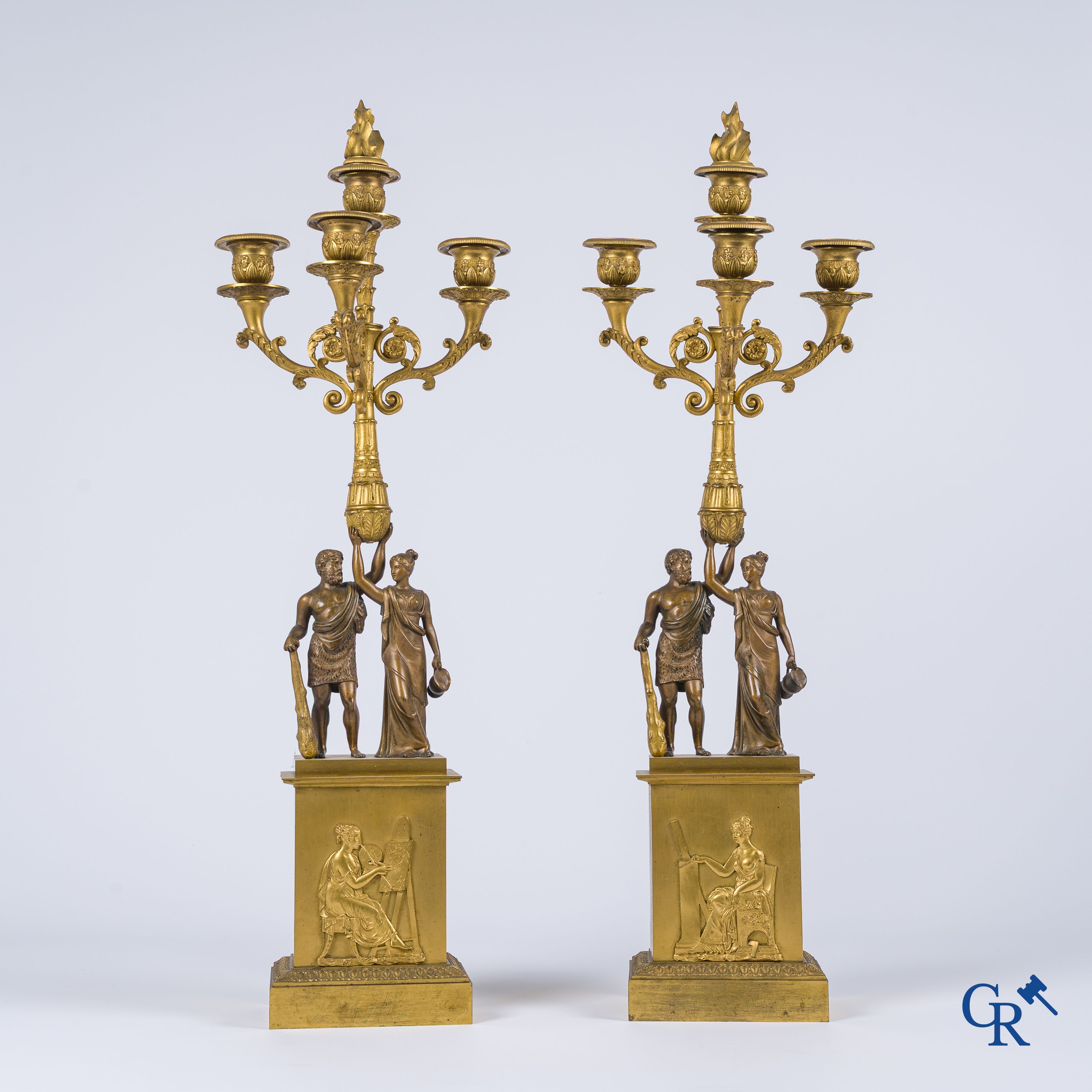 Empire era. A pair of large bronze candlesticks with characters in the antique style. Empire, circa 1815.