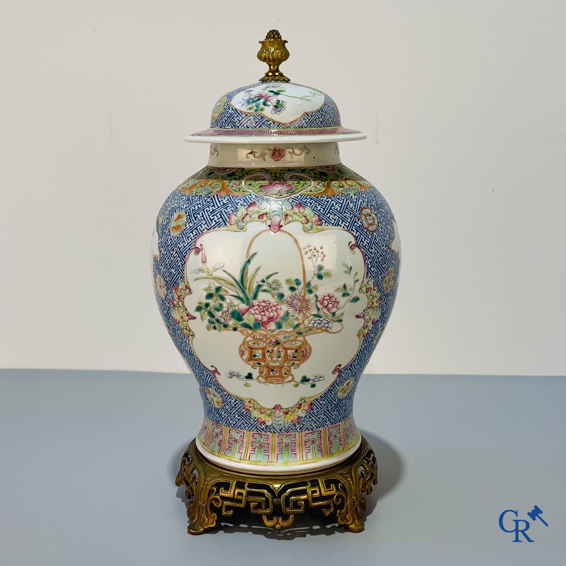 Asian Art, Chinese porcelain, a finely decorated Chinese famille rose vase with bronze. 19th century.