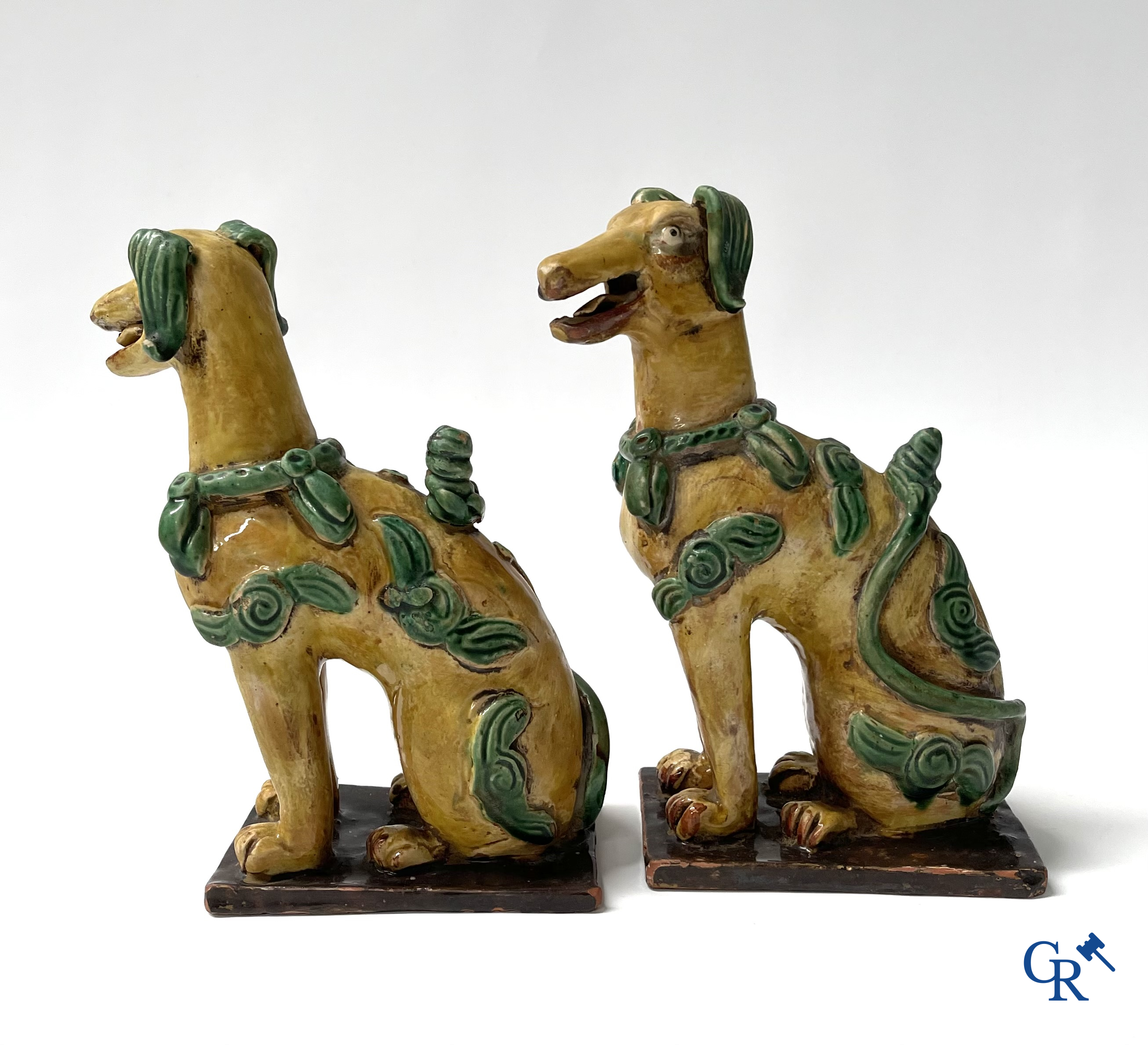 Asian Art, Chine. A pair of seated enamelled terra cotta dogs.