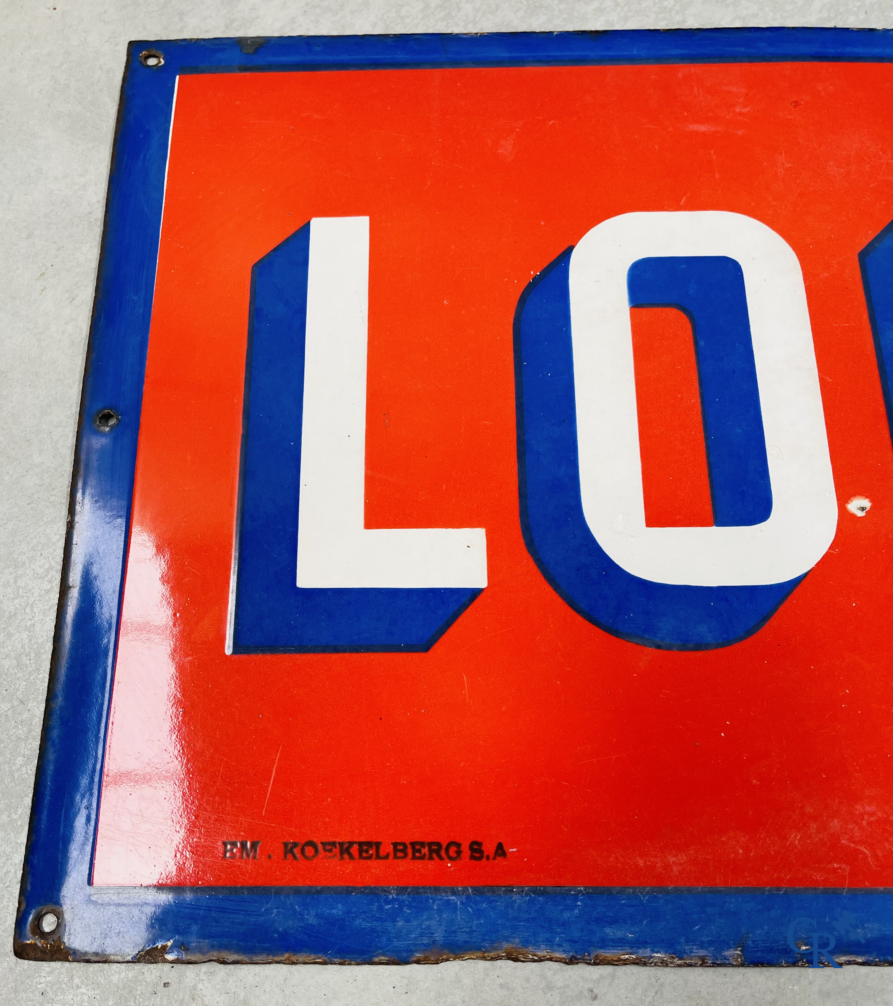 A large enamel advertising sign for Louwaege's beer. Enamel Koekelberg. T.P. Bruxelles 1950.