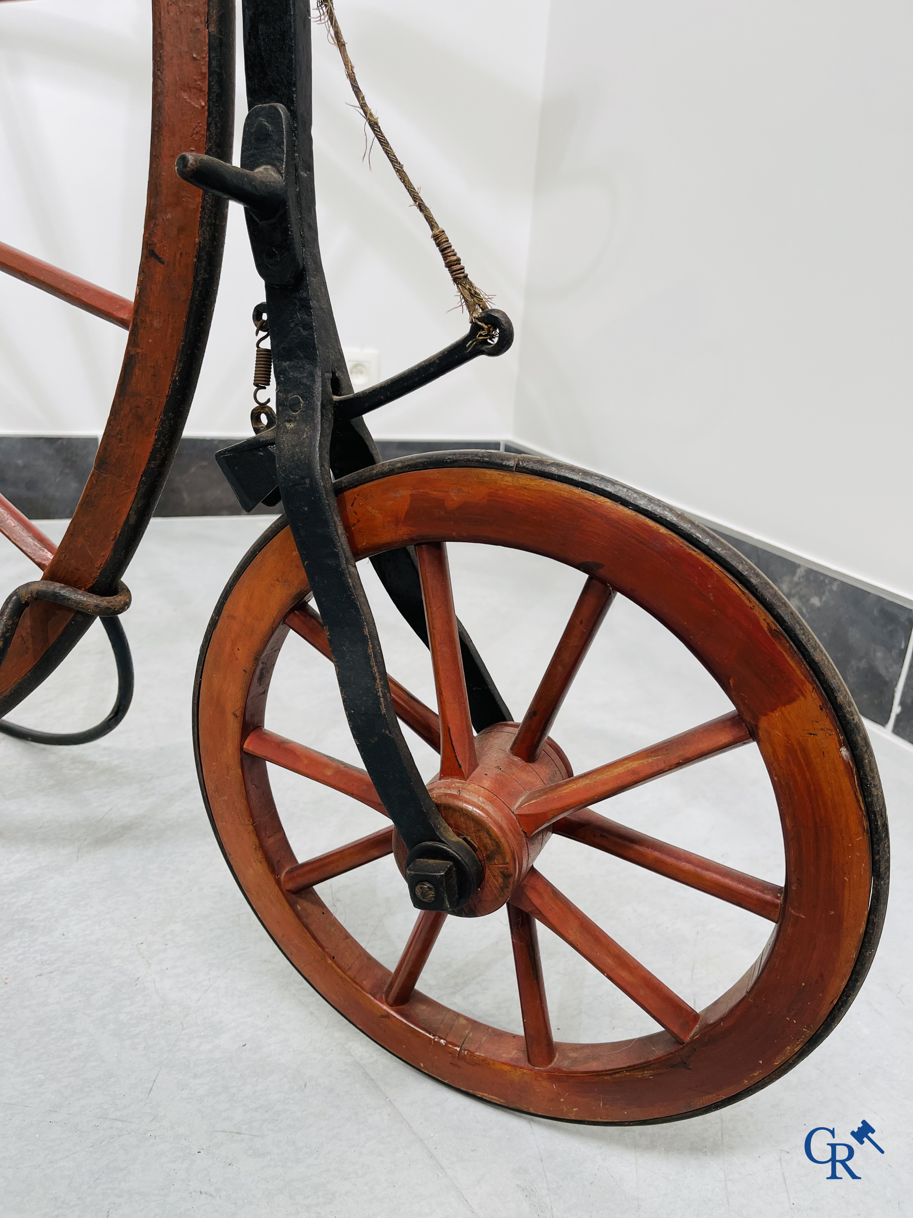 Penny-farthing with wooden spoked wheels on the original wrought iron upright. Circa 1880.