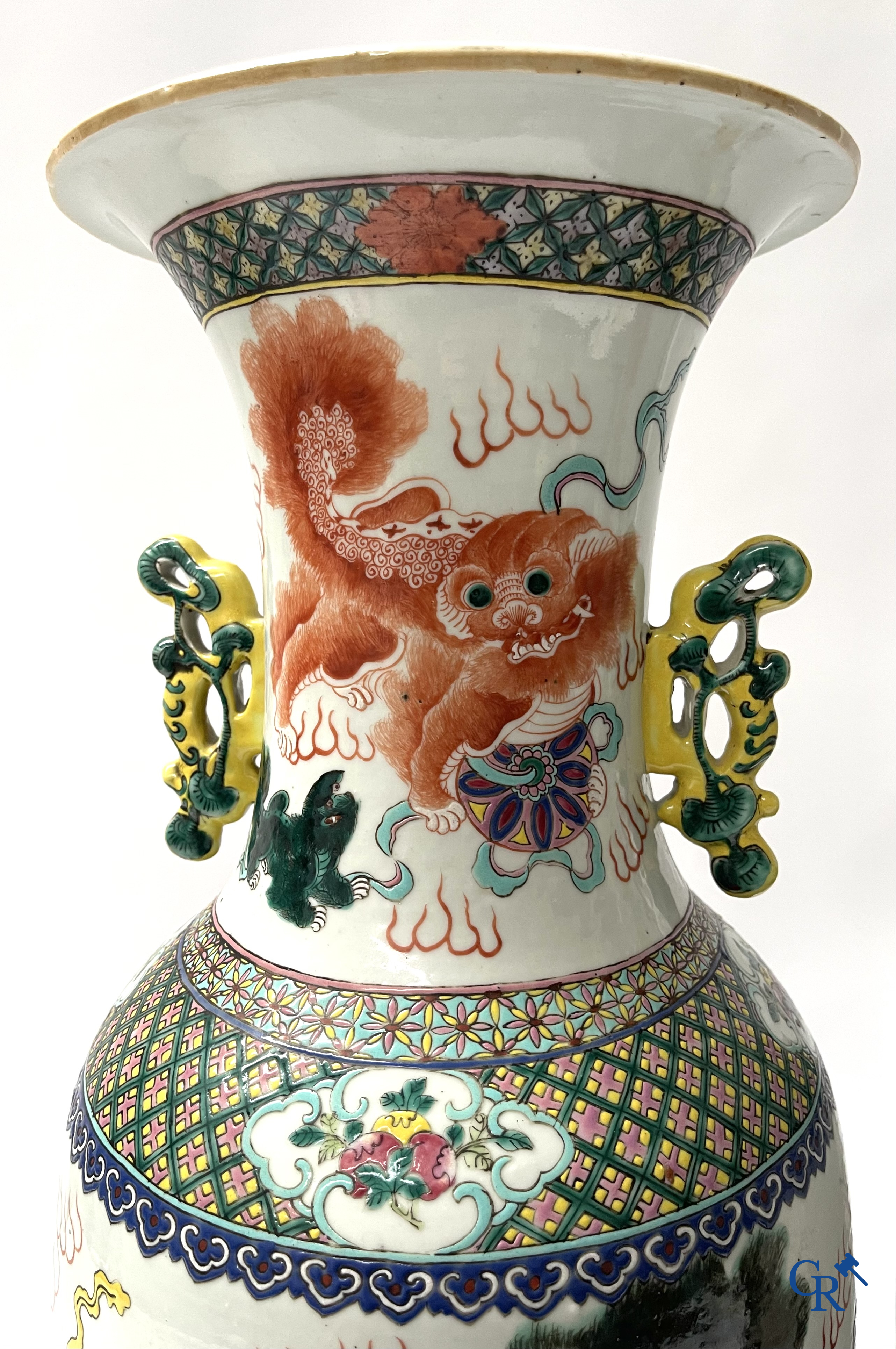 Asian Art, A pair of Chinese famille rose vases with peacocks and Fo dogs. 19th century.
