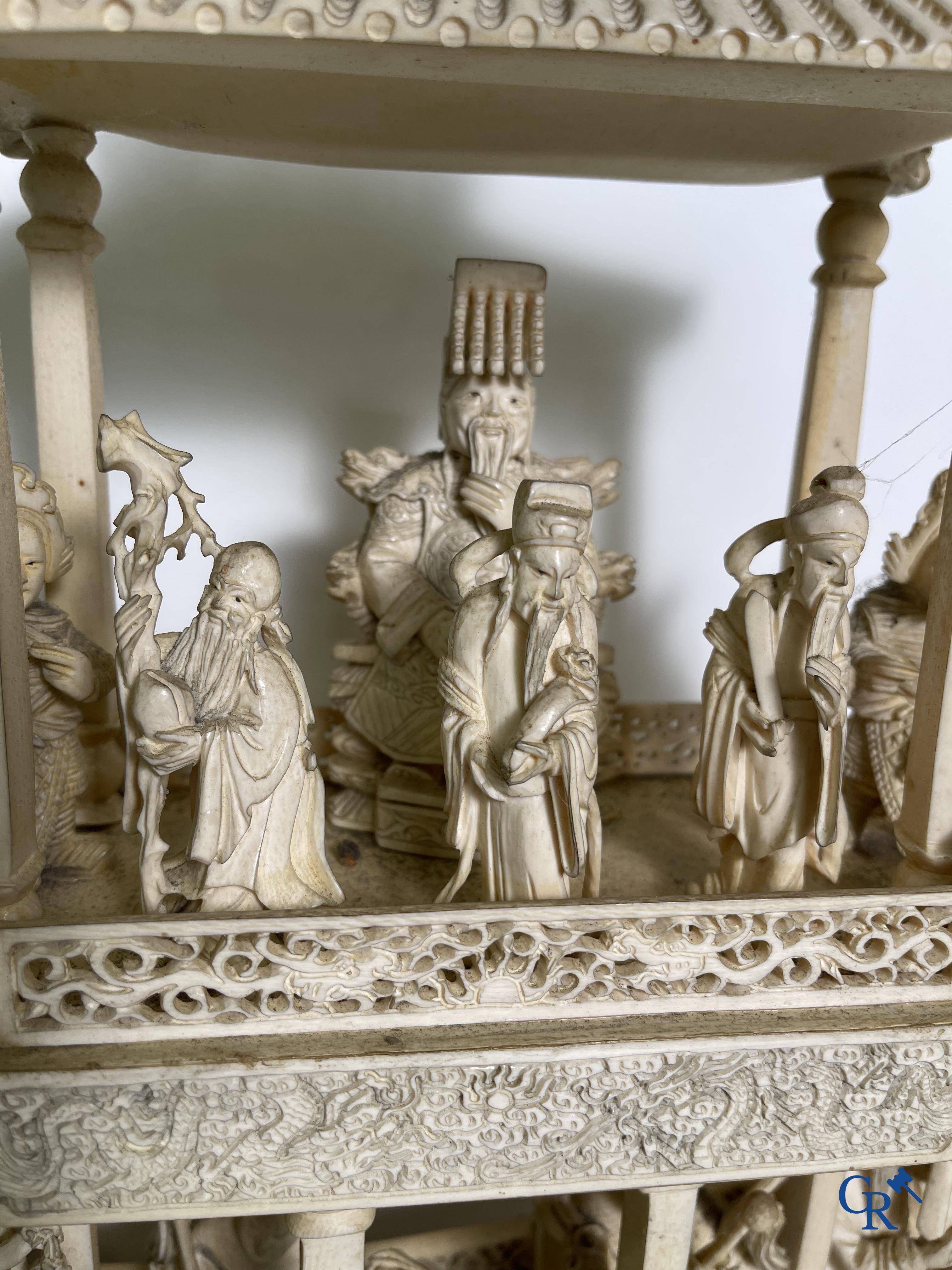 Asian Art: A large Chinese ivory dragon boat on a wooden pedestal. 19th century.