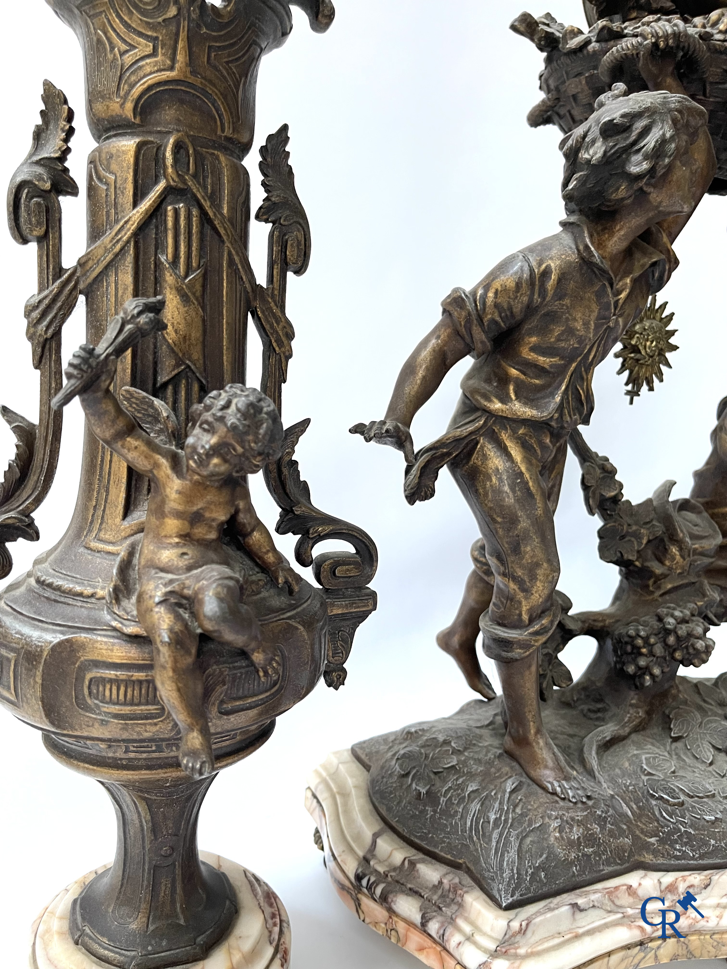 Louis & François Moreau (after). A large 3-piece fireplace set in spelter and marble. Circa 1910.