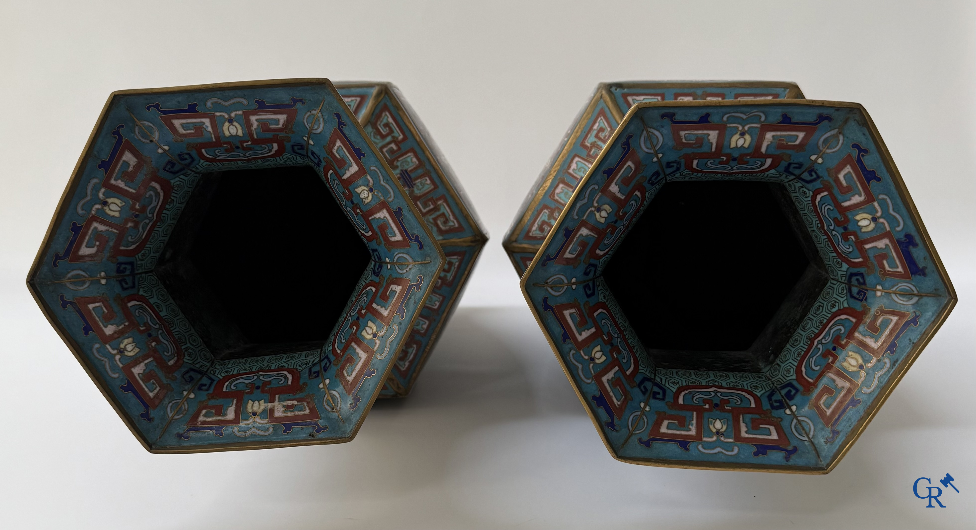 Asian Art, a large pair of hexagonal Chinese cloisonné vases with a decor of antiques.
