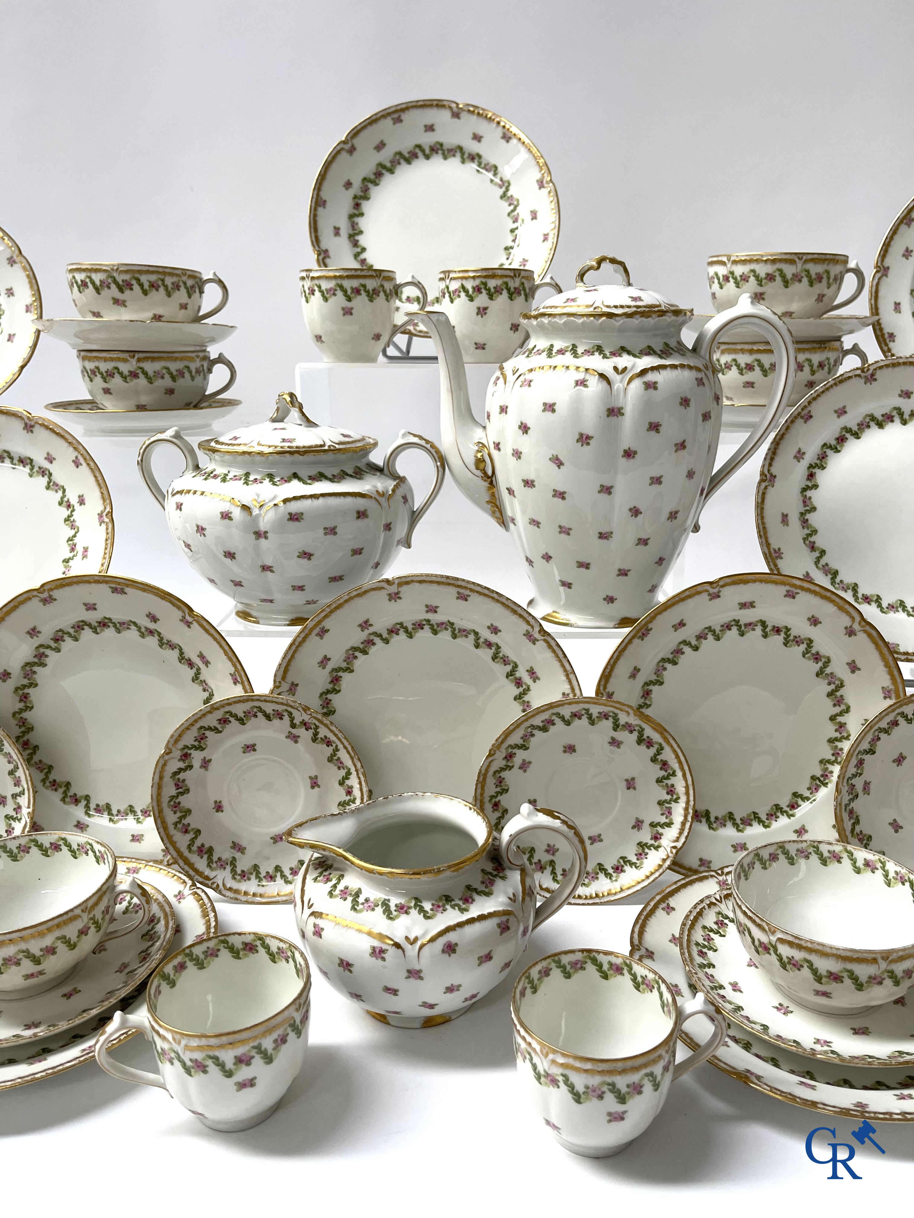 A coffee and tea set with 12 dessert plates in gilded and polychrome decorated French porcelain. Around 1900.