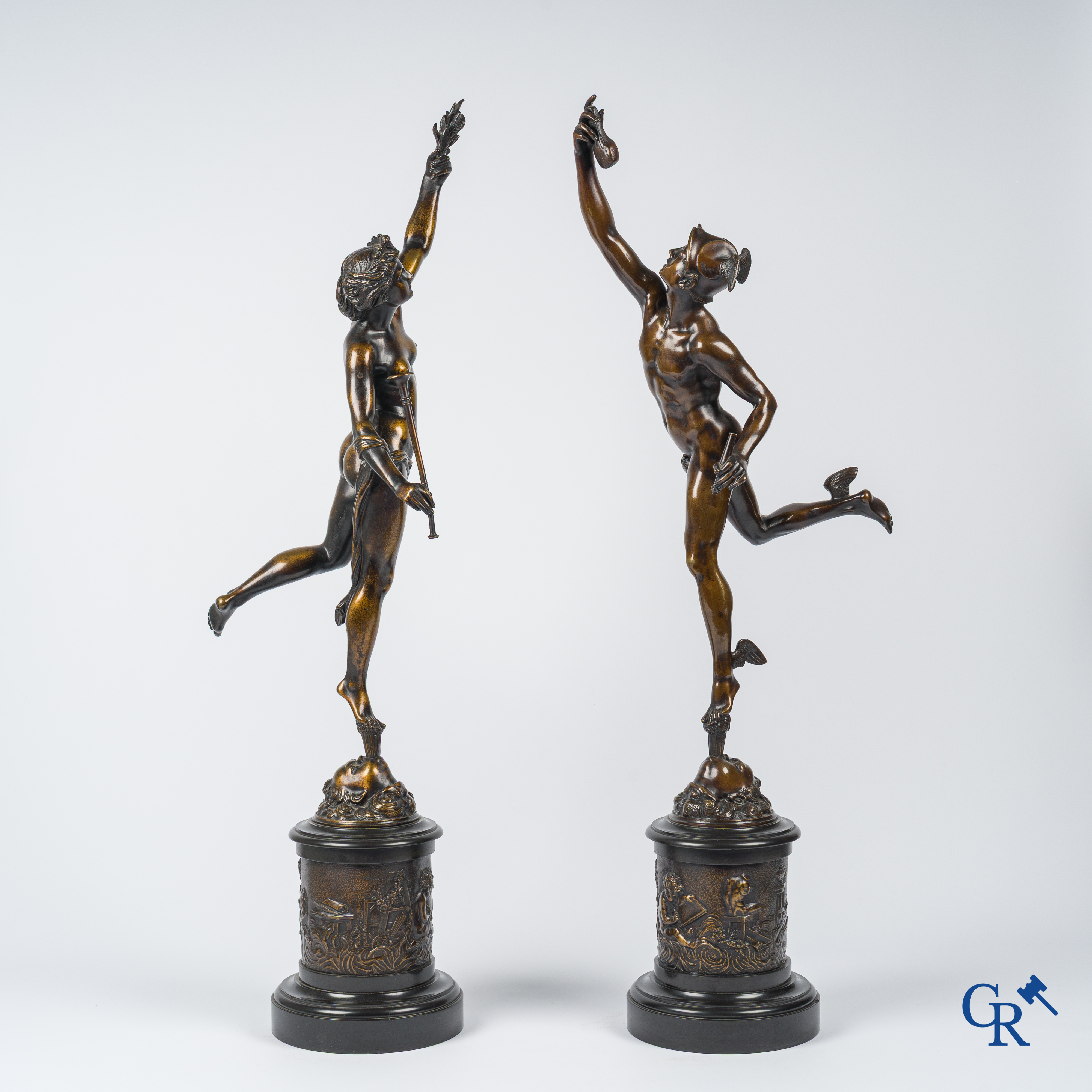 A pair of imposing bronze statues in the antique style after a model by Jean De Bologne.
