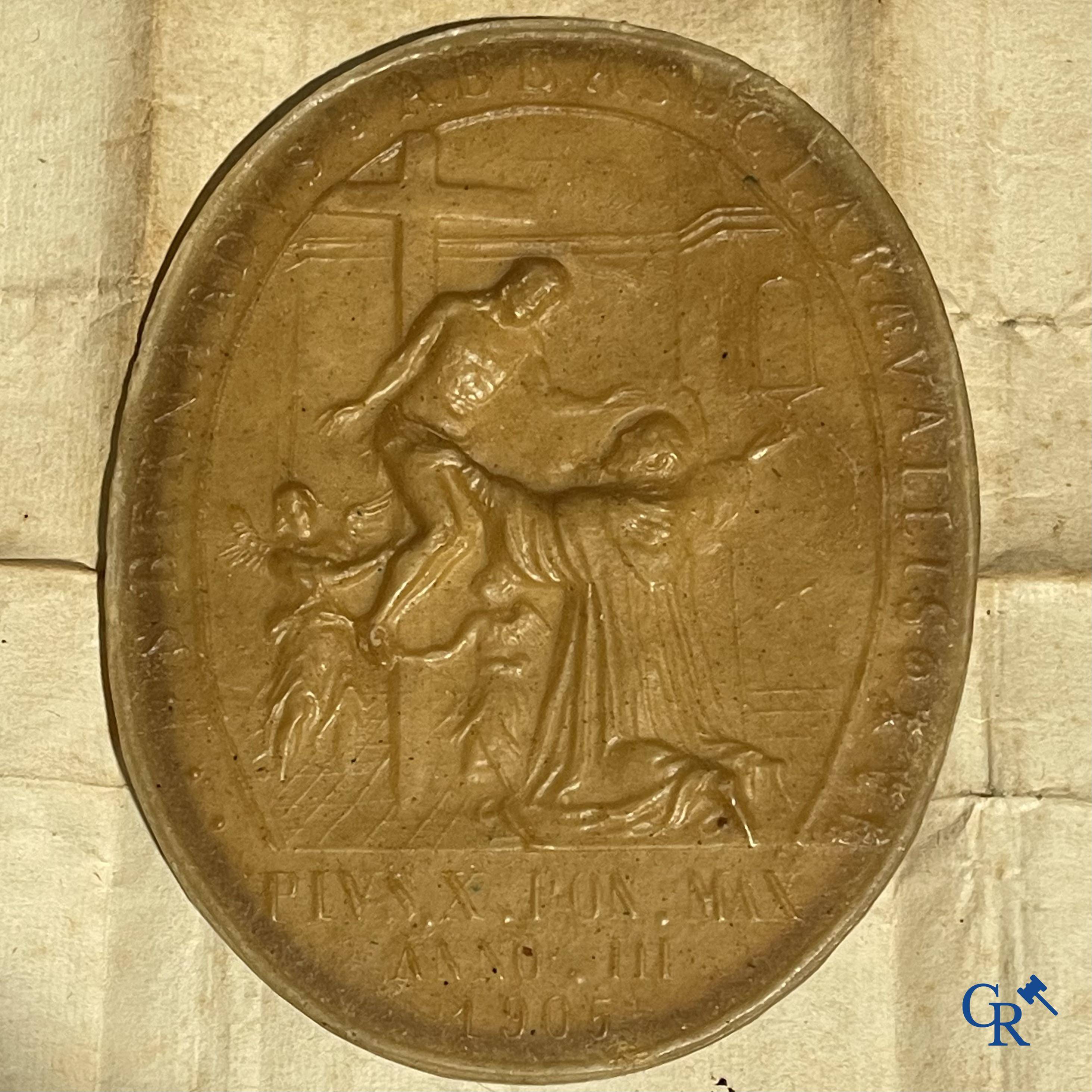 Religious objects, Agnus Dei in wax, blessed by Pope Pius X in 1905, with the image of Bernard of Clairvaux.