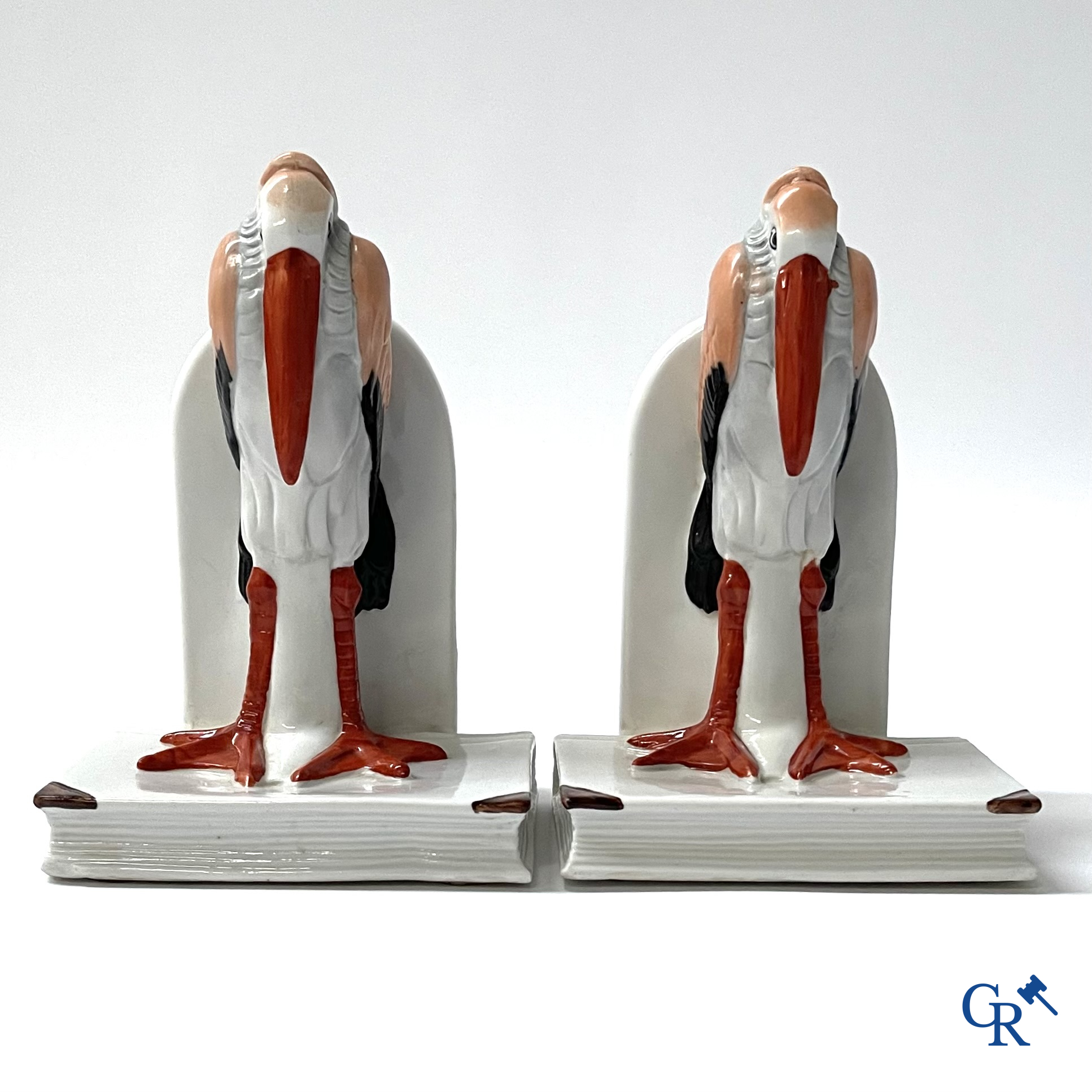 Art Deco, a pair of bookends in polychrome porcelain with a typical Art Deco representation of marabou.
