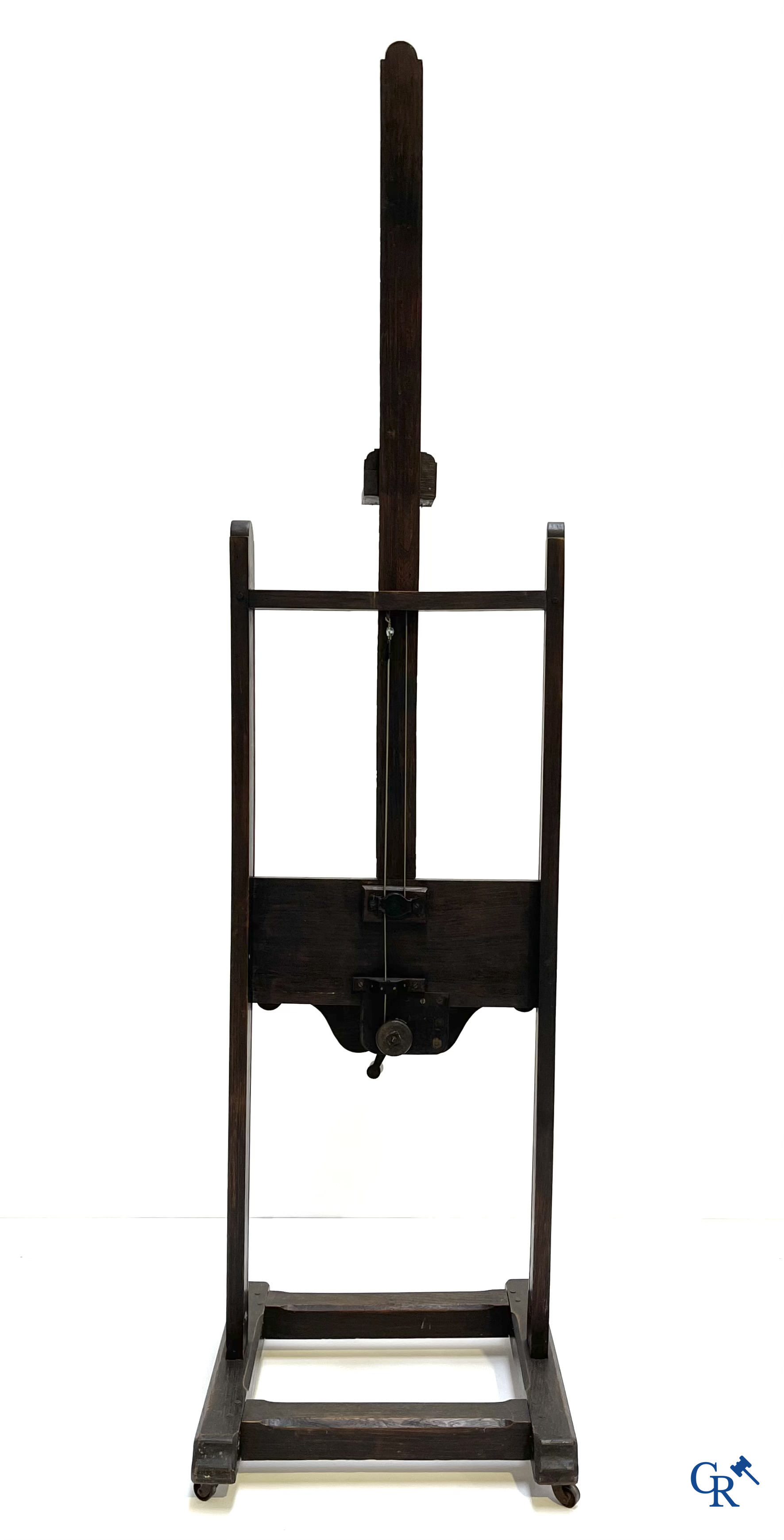 A large antique painter's studio easel with crank adjustment system. 19th century.
