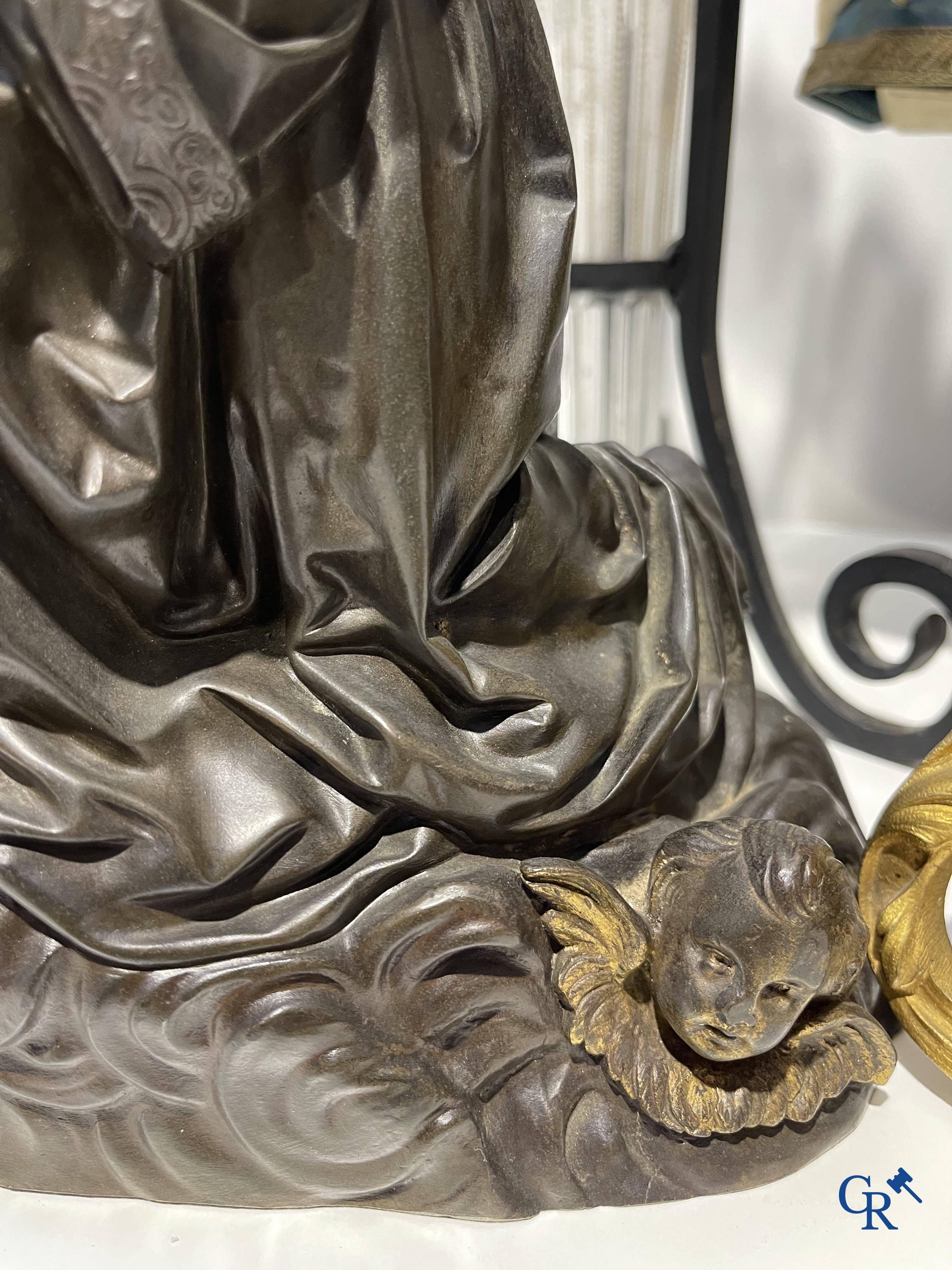 A lot with brocante: Bronze clock, bronze neo Gothic candlesticks and a statue of St. Catharina, soliflore etc.