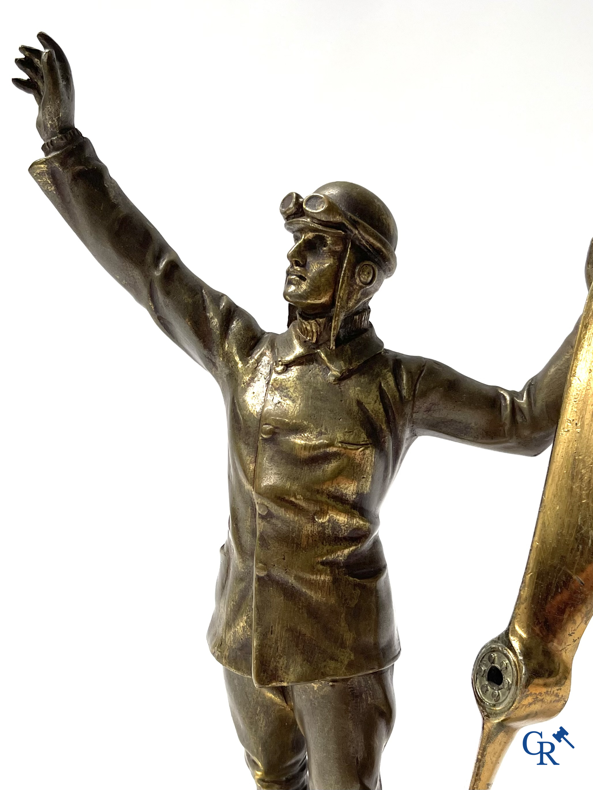 Aeronautics, a bronze representation of an aircraft pilot with propeller. Around 1930.