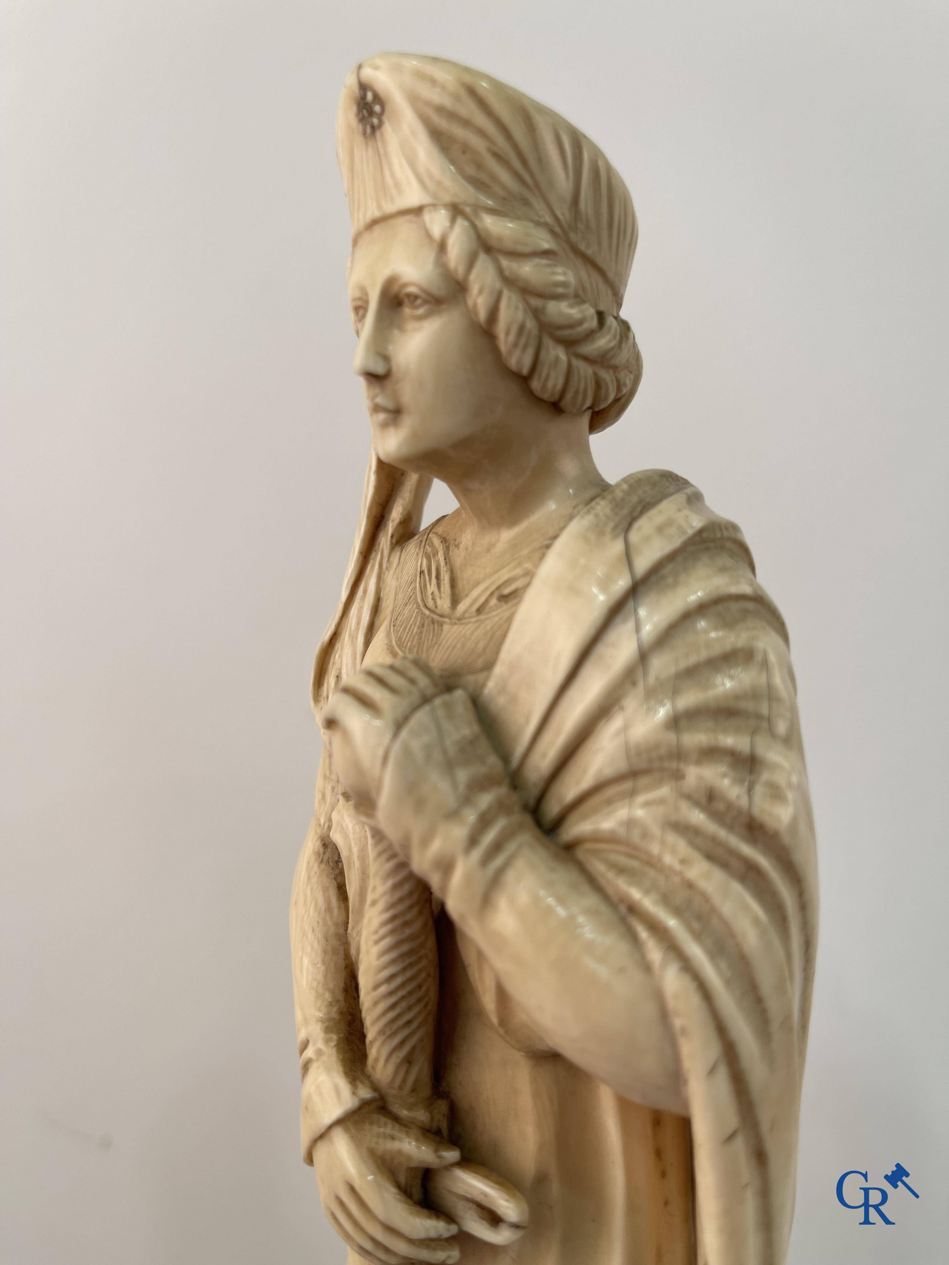 Dieppe, French work, early 19th century. Representation of Catherine of Alexandria in ivory on a pedestal.