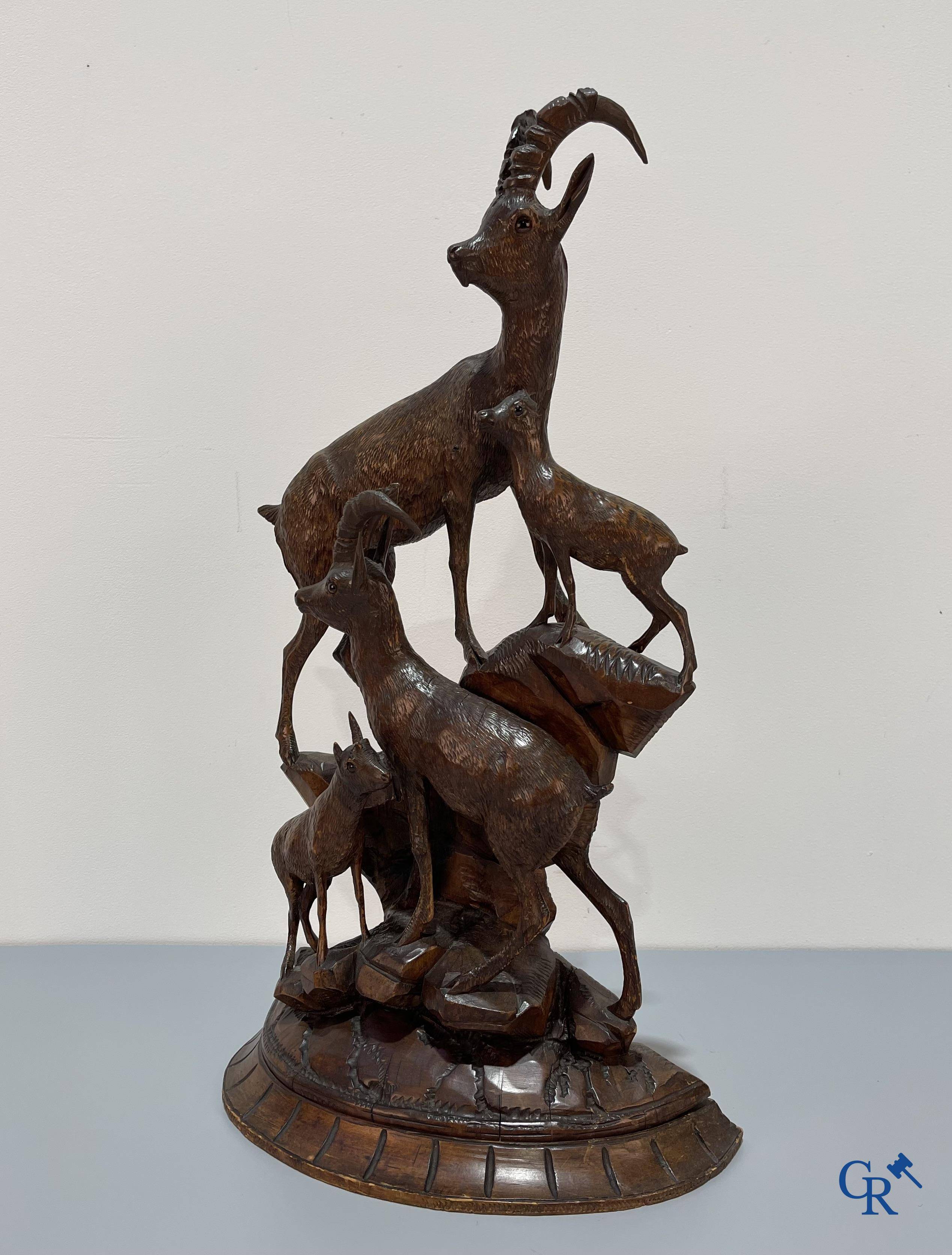 A Black Forest wood sculpture with capricorns, Germany circa 1900.