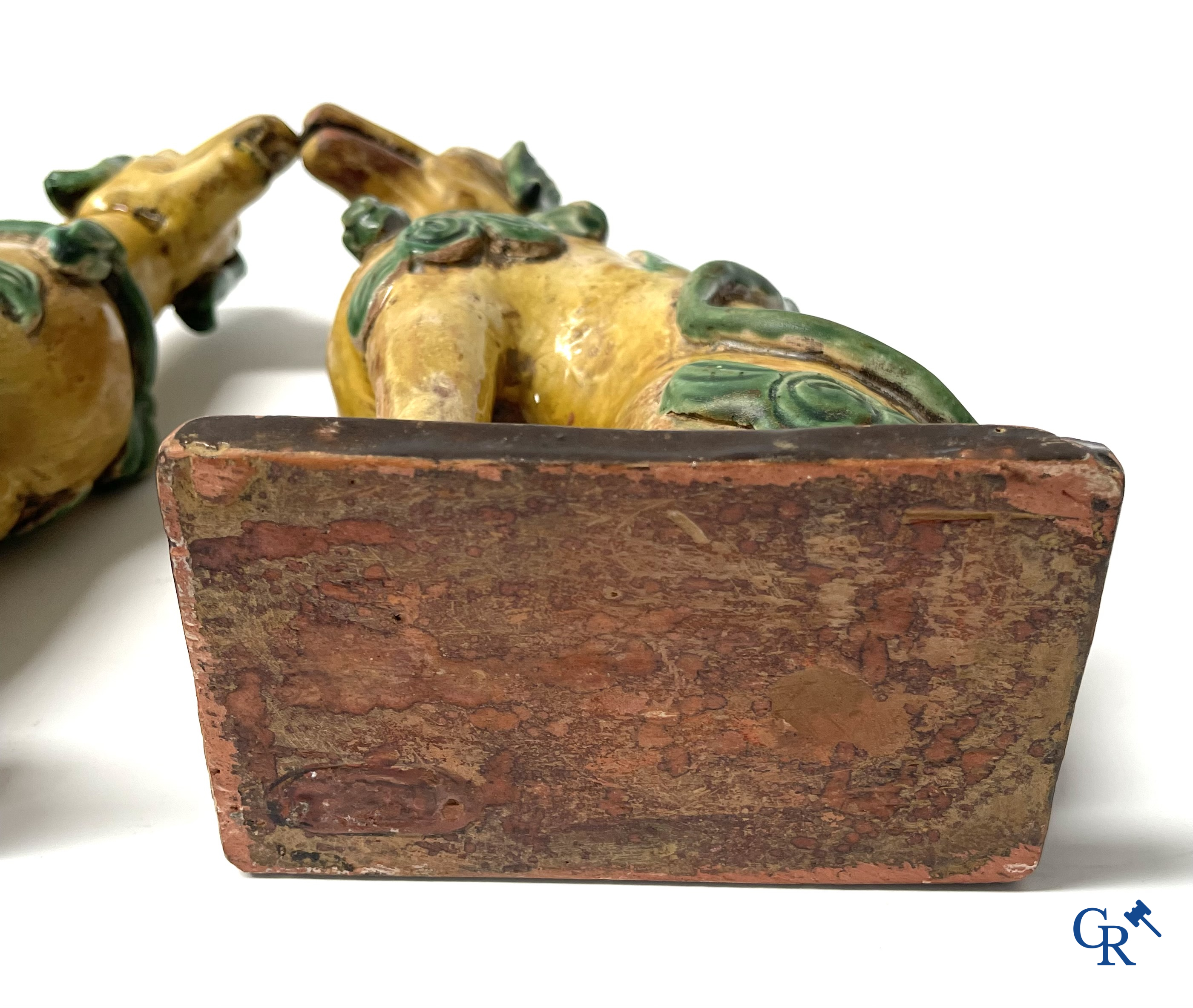 Asian Art, Chine. A pair of seated enamelled terra cotta dogs.